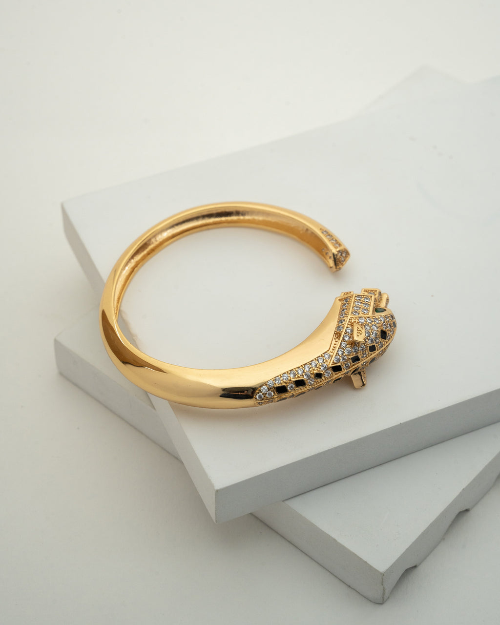 Elegant Gold-Plated Bangle with Intricate Stone Detailing
