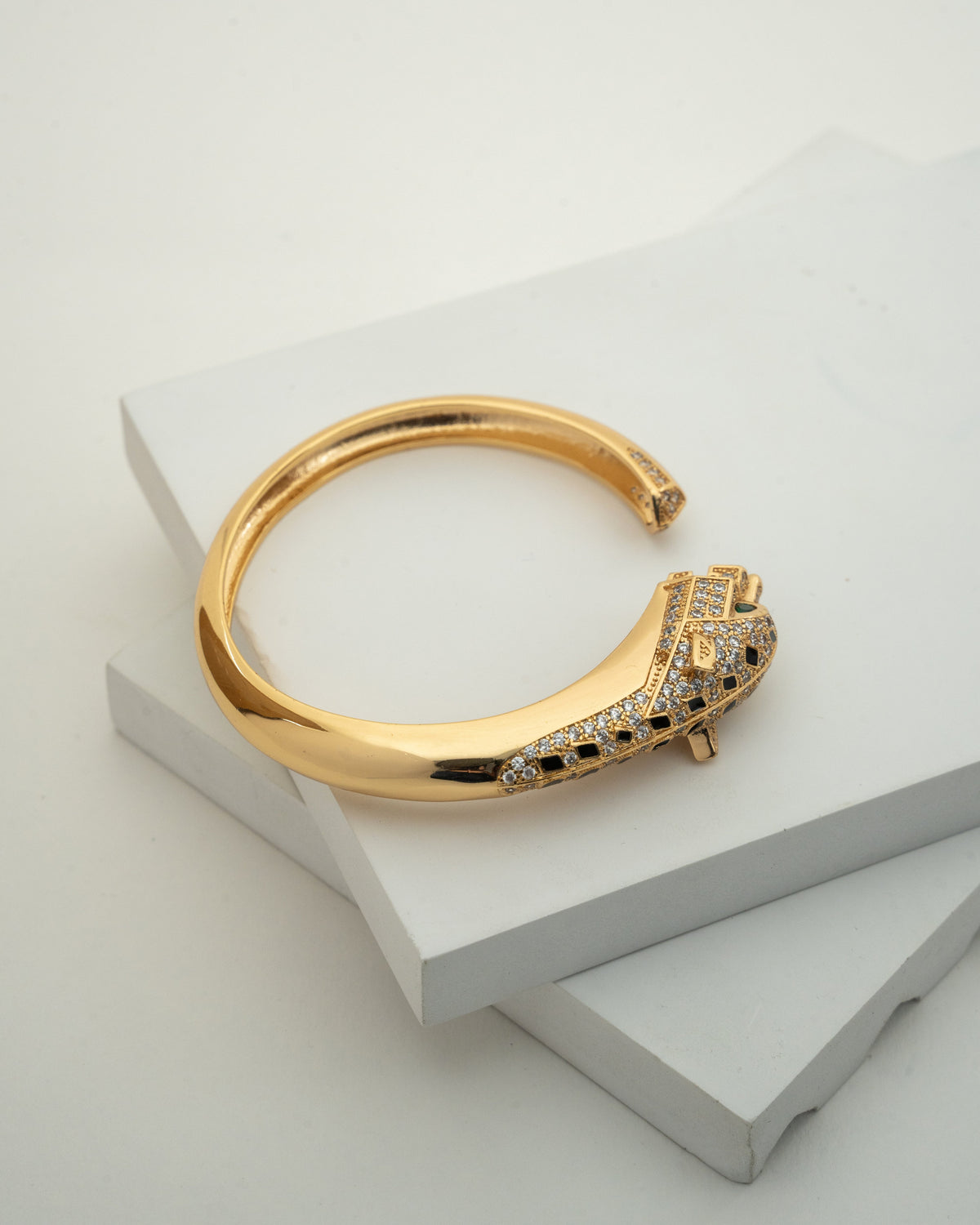 Elegant Gold-Plated Bangle with Intricate Stone Detailing
