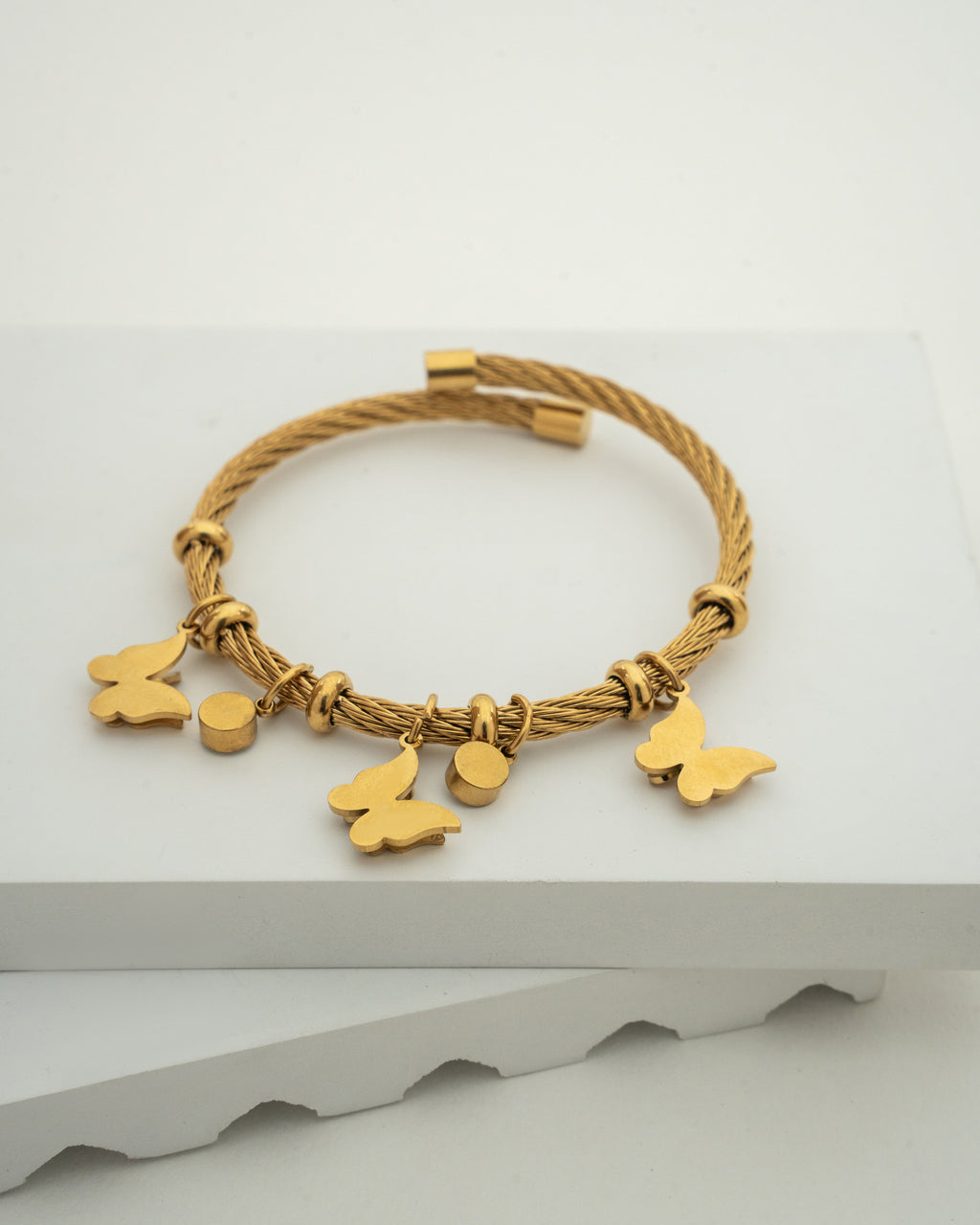 Elegant Gold Charm Wire Bracelet with Butterfly Accents