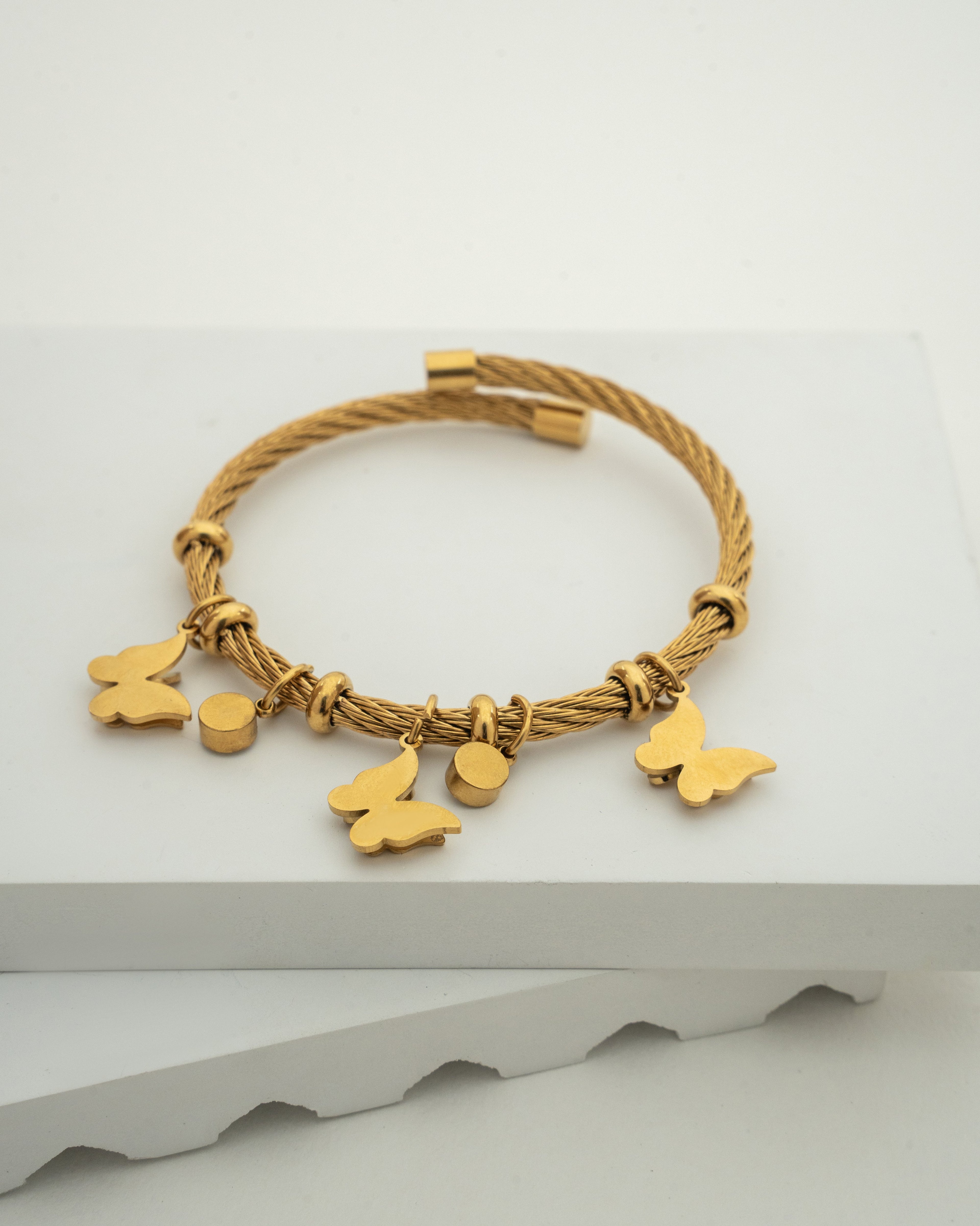 Elegant Gold Charm Wire Bracelet with Butterfly Accents