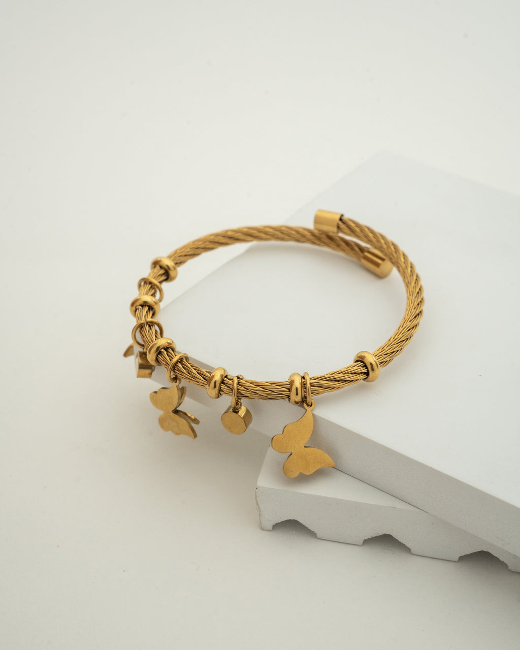 Elegant Gold Charm Wire Bracelet with Butterfly Accents