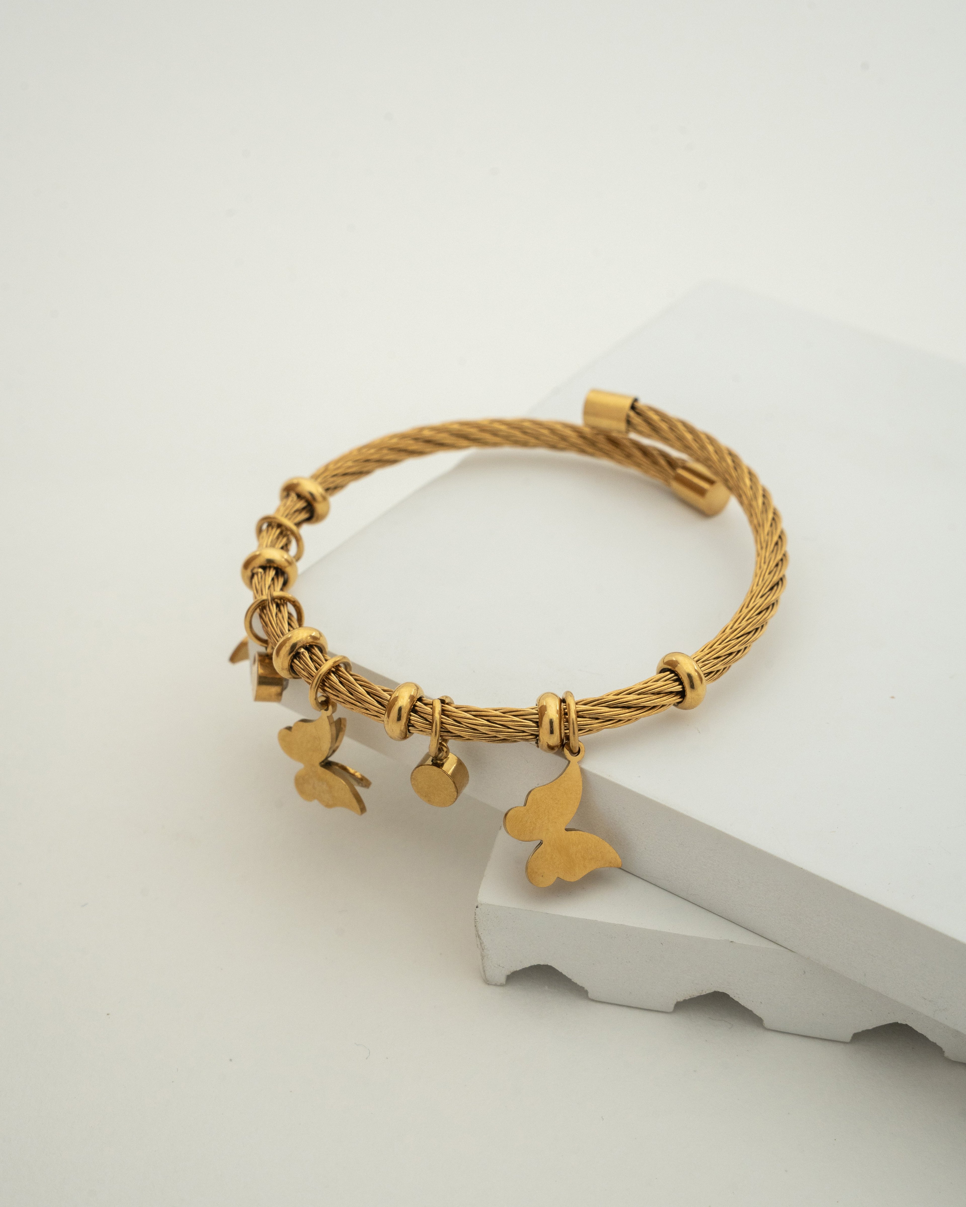 Elegant Gold Charm Wire Bracelet with Butterfly Accents