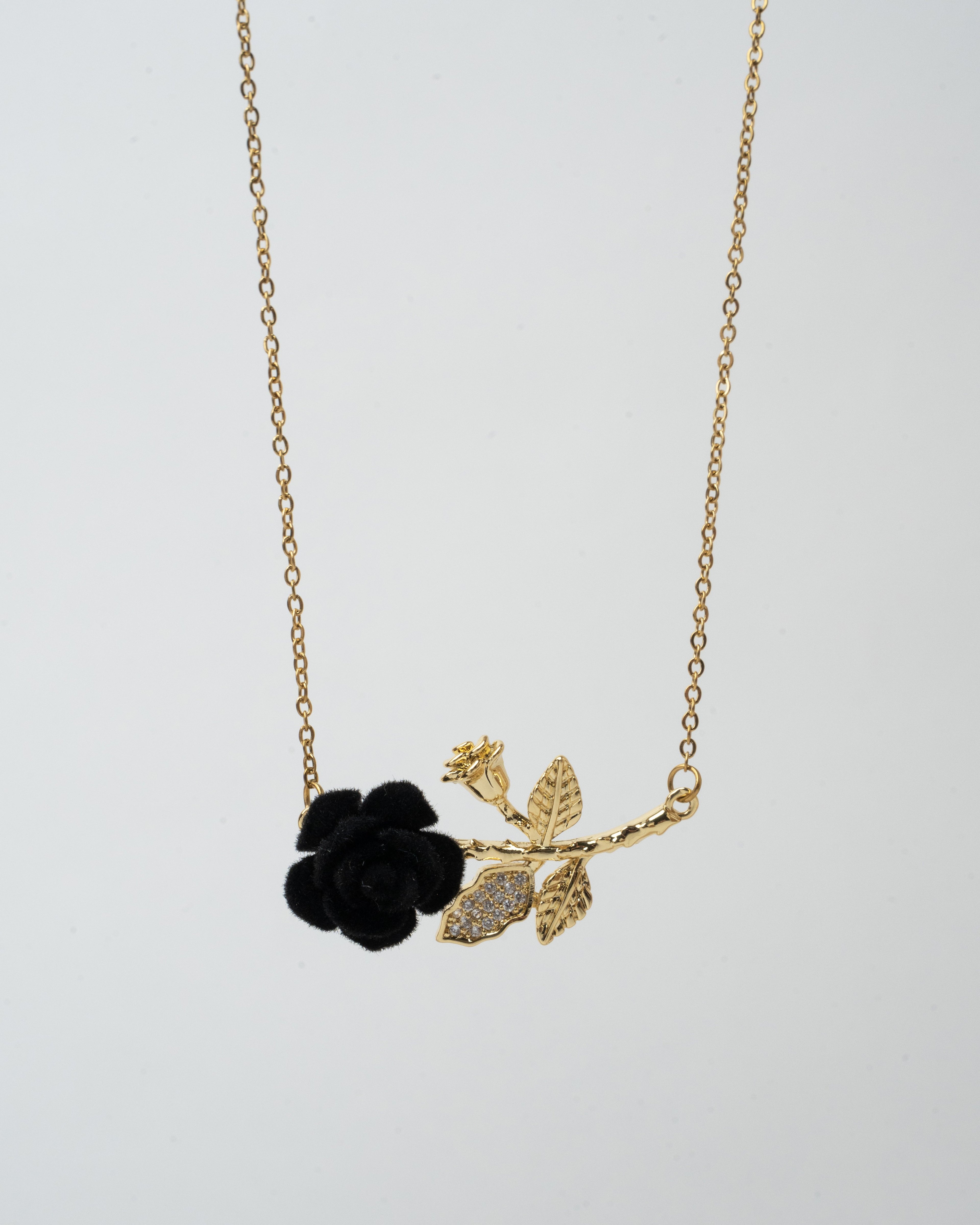 Elegant Gold Rose Pendant Necklace with Black Floral Accent