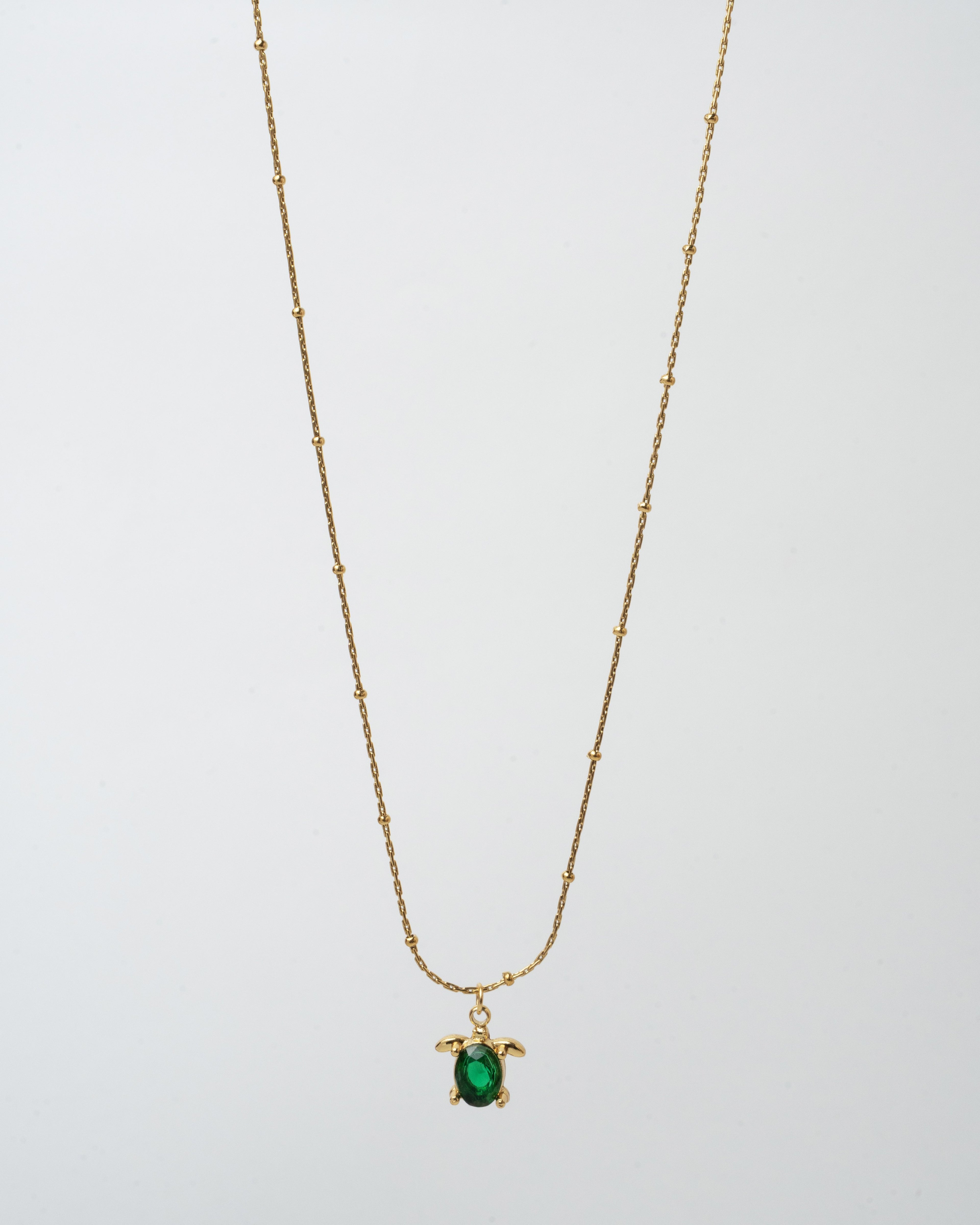 Elegant Gold Turtle Pendant Necklace with Emerald Green Gem
