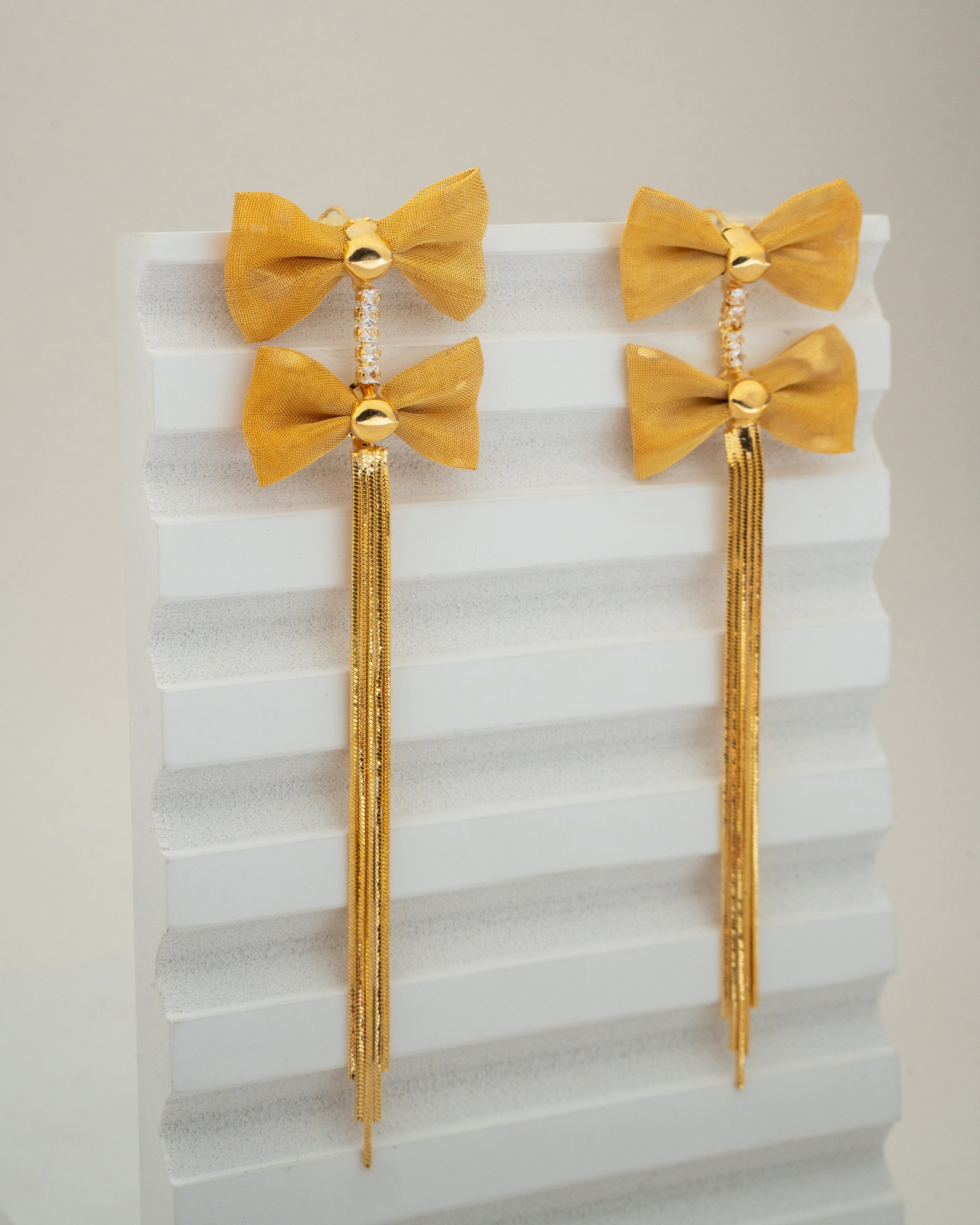 Elegant Gold Bow Tassel Earrings with Crystal Accents
