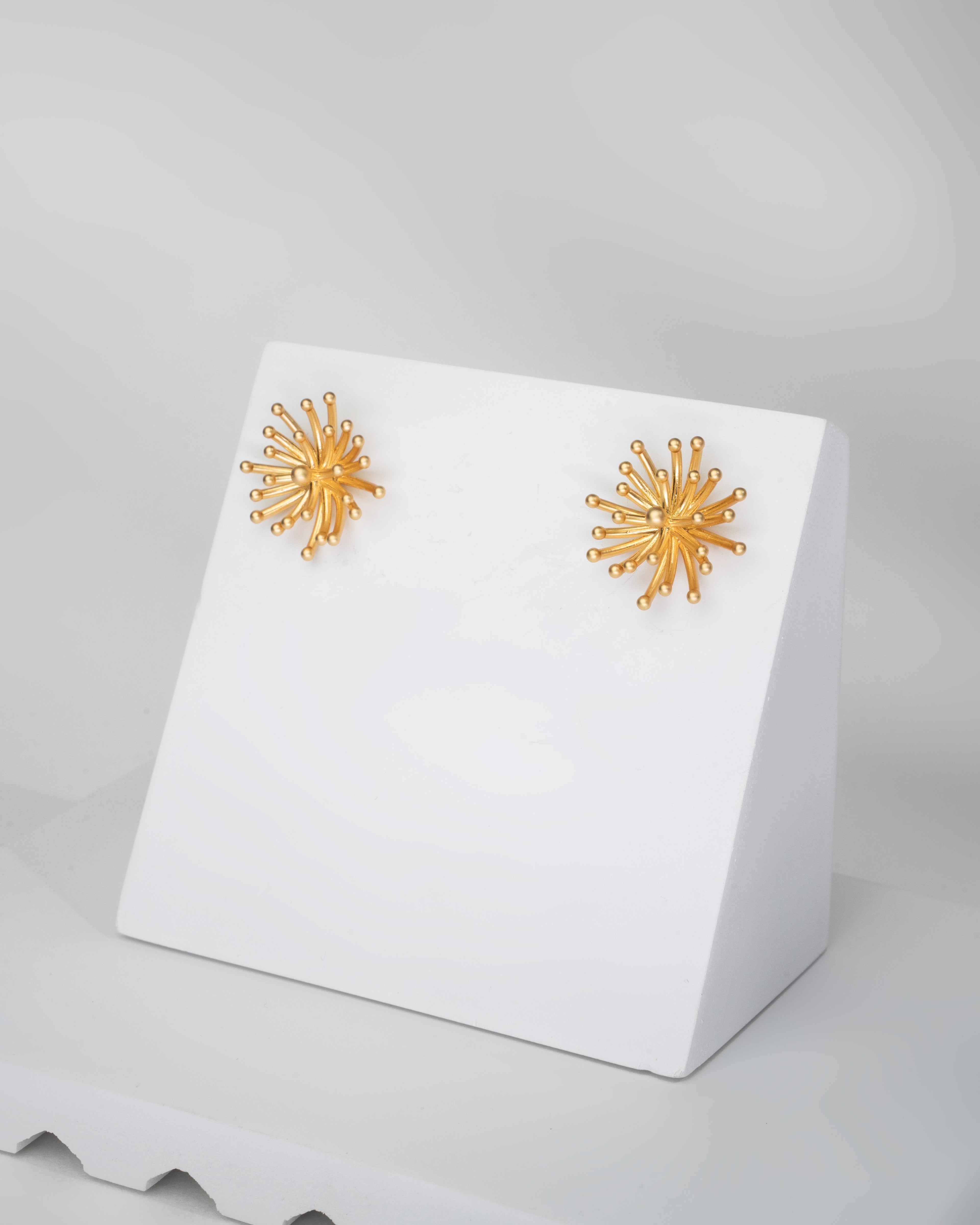Radiant Sunburst Gold Tone Stud Earrings