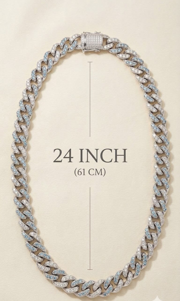 A silver-toned Cuban link chain necklace with pavé-set clear stones, shown on a light beige background with a central measurement overlay reading '24 INCH (61 CM)'.