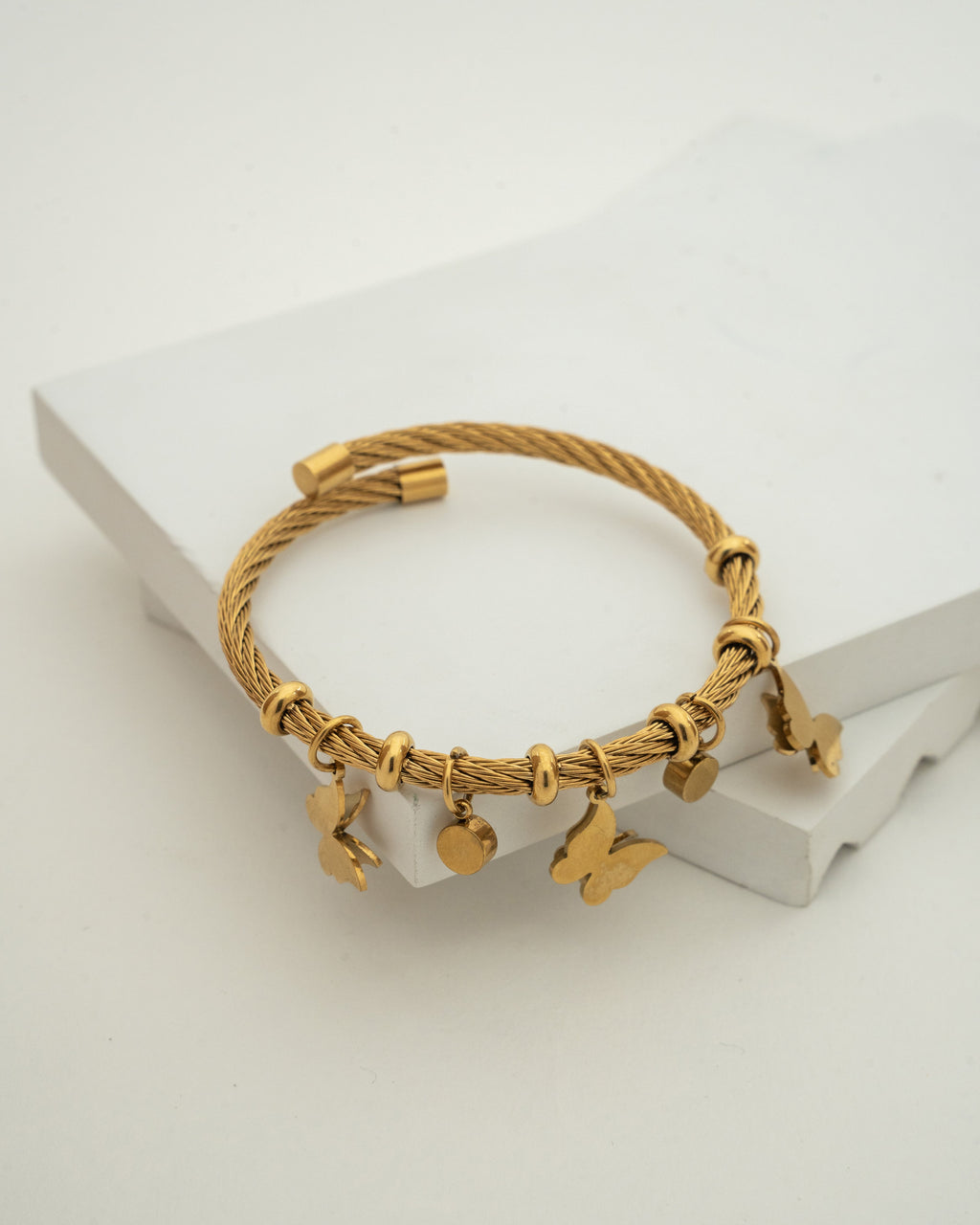 Elegant Gold Charm Wire Bracelet with Butterfly Accents
