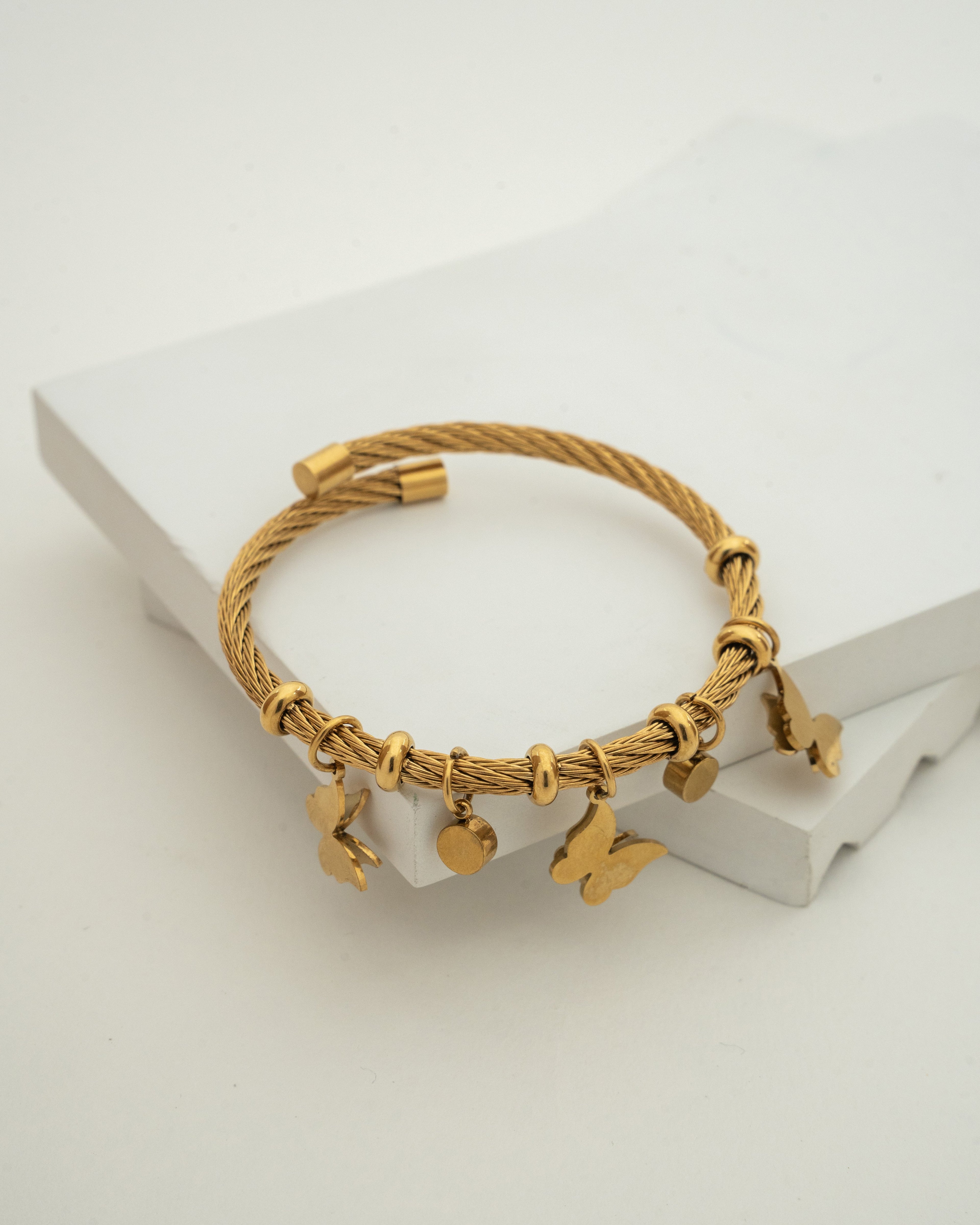Elegant Gold Charm Wire Bracelet with Butterfly Accents