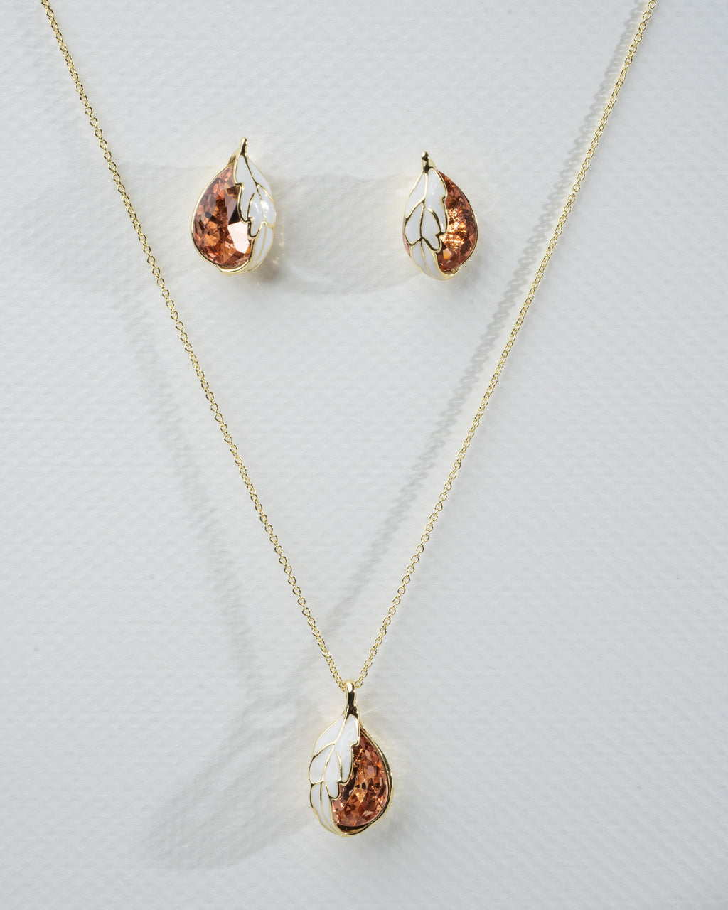 Elegant Gold-Plated Leaf Motif Jwelery Set With Enamel and Crystal Accents