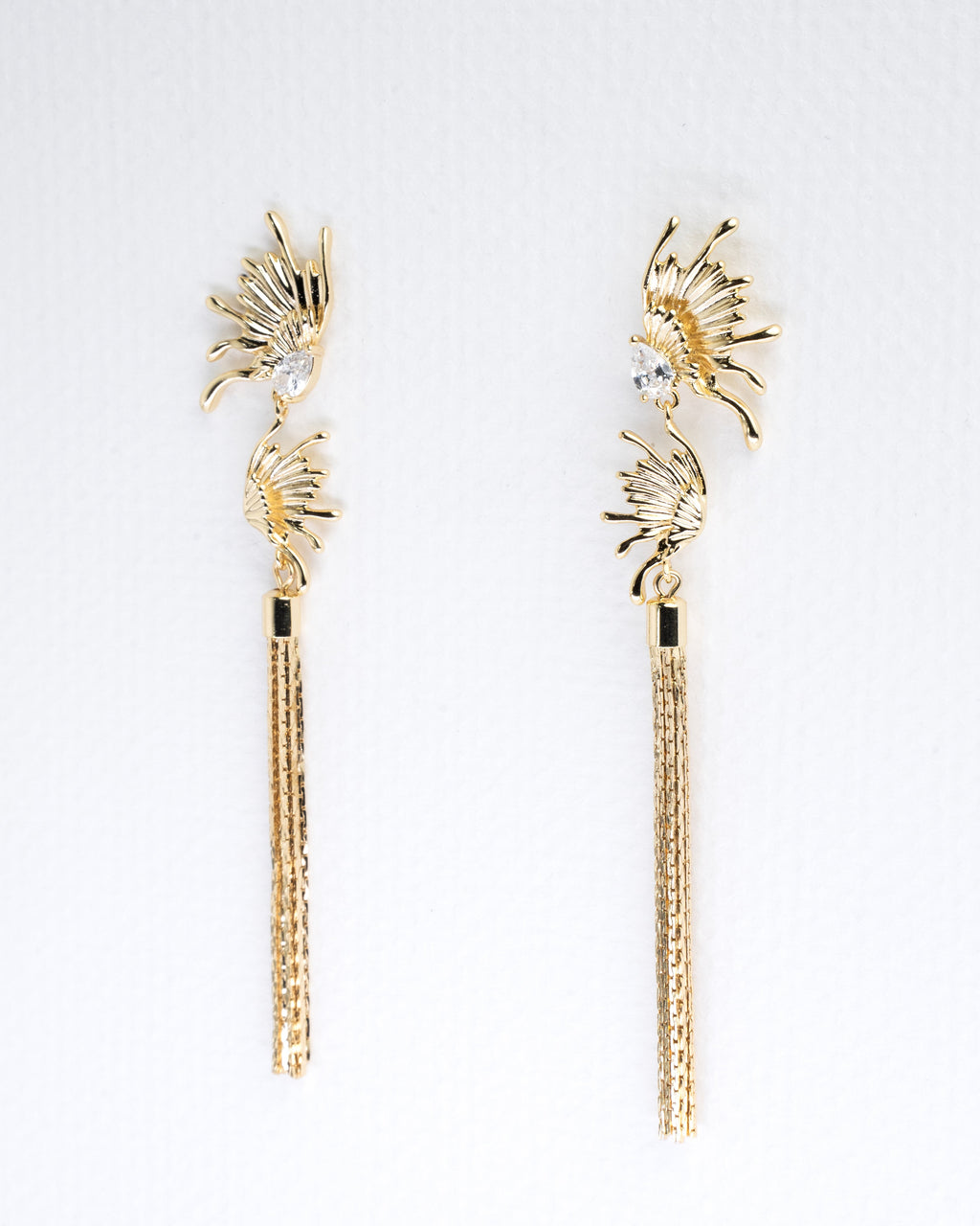 Elegant Sunburst Crystal and Gold Tassel Earrings