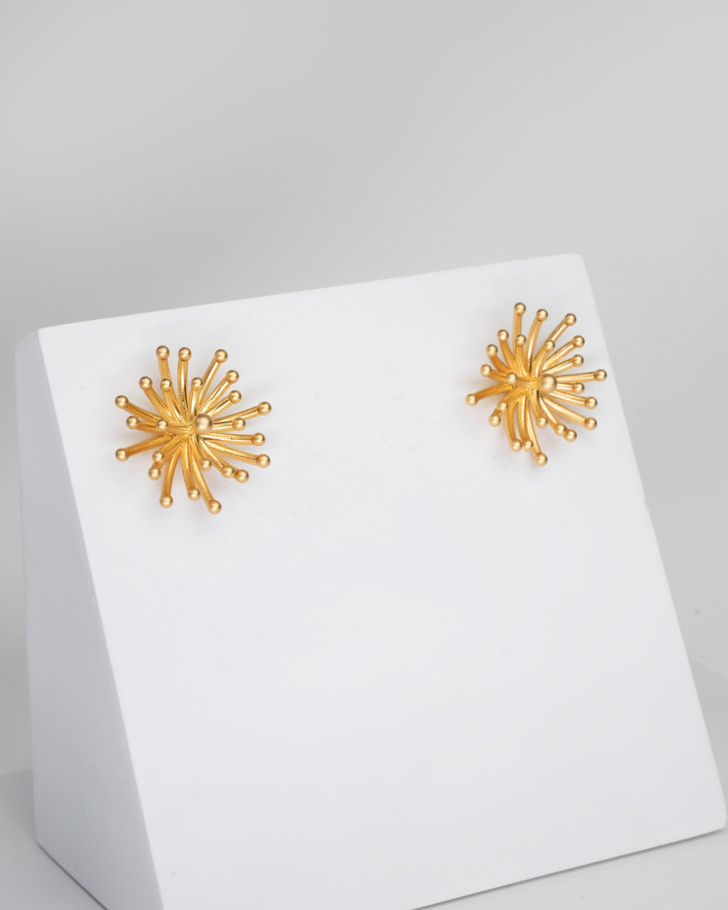 Radiant Sunburst Gold Tone Stud Earrings