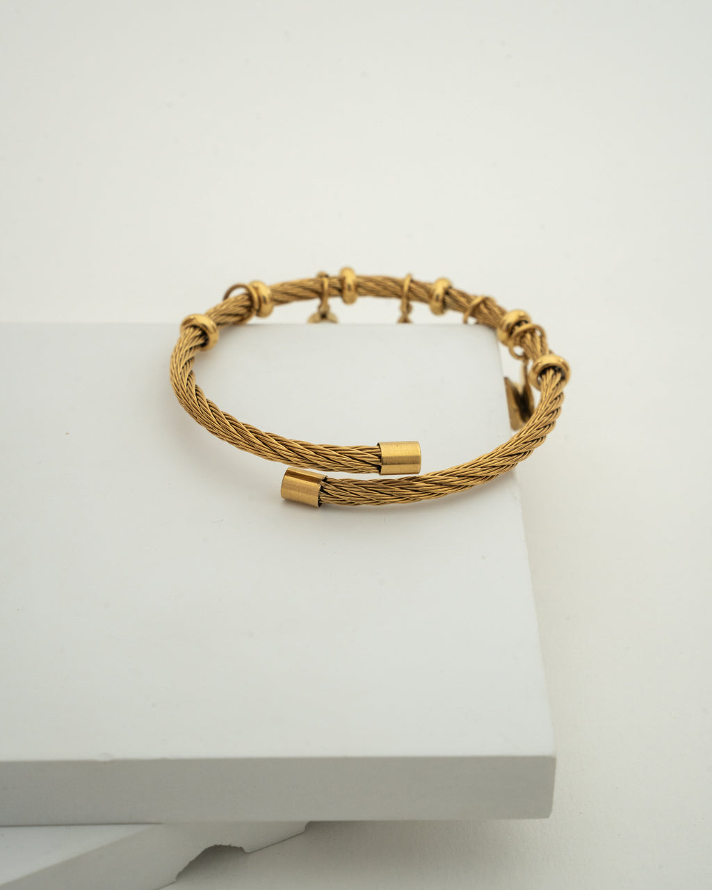 Elegant Gold Charm Wire Bracelet with Butterfly Accents