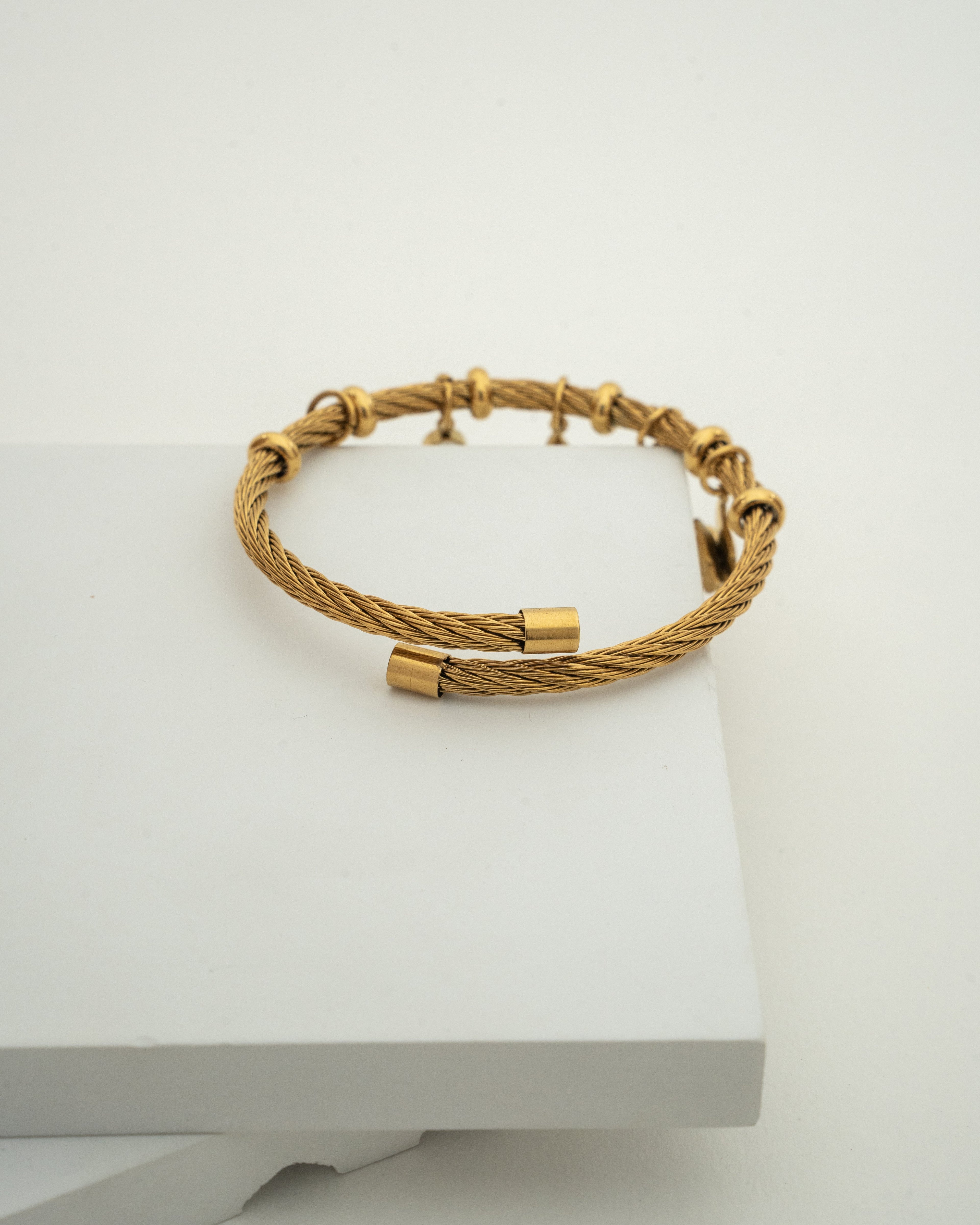 Elegant Gold Charm Wire Bracelet with Butterfly Accents