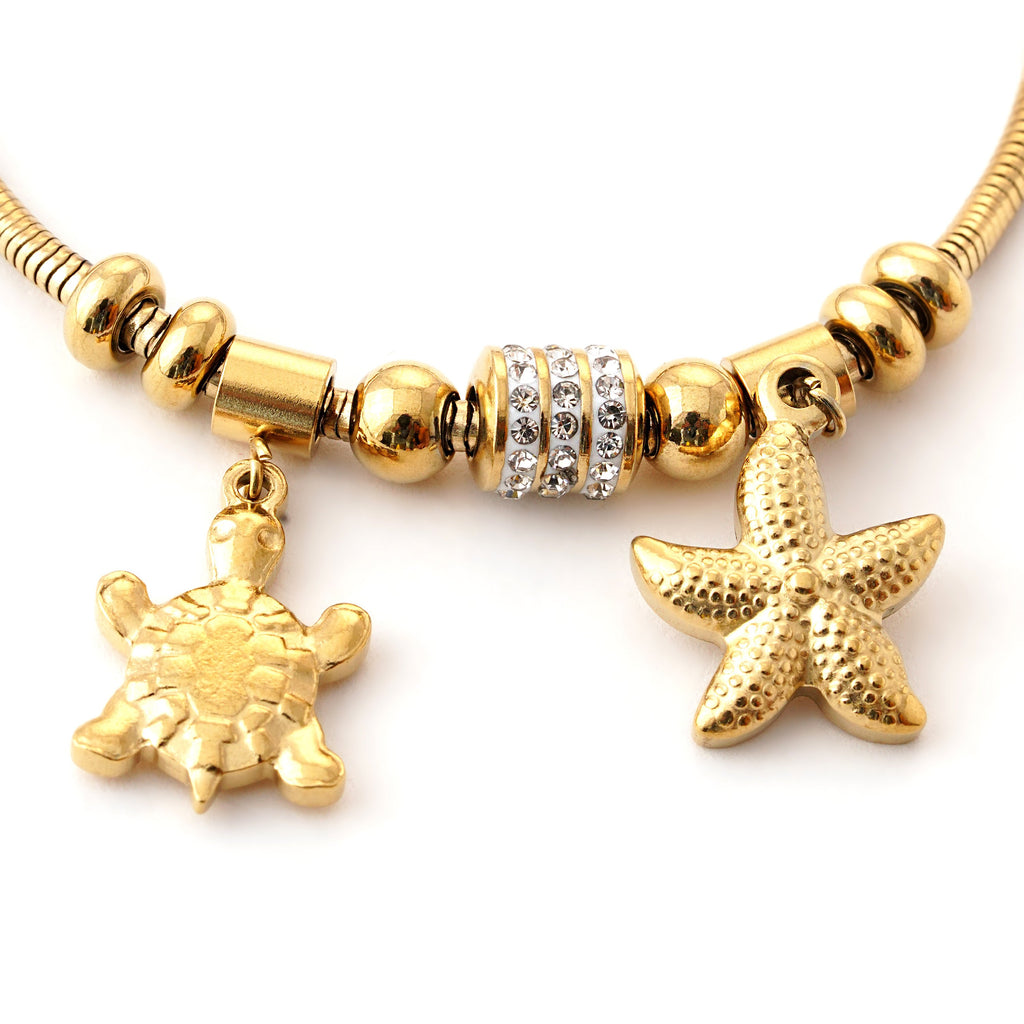 Elegant Gold Charm Bracelet with Ocean-Inspired Pendants