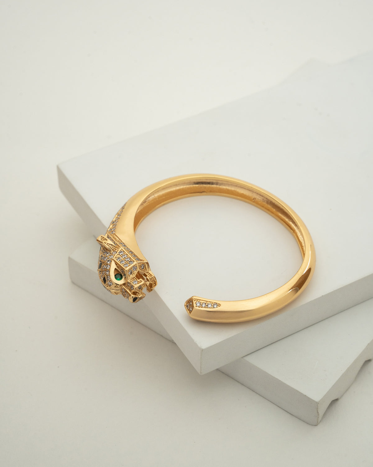 Elegant Gold-Plated Bangle with Intricate Stone Detailing