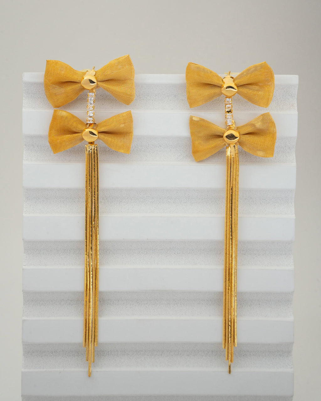 Elegant Gold Bow Tassel Earrings with Crystal Accents