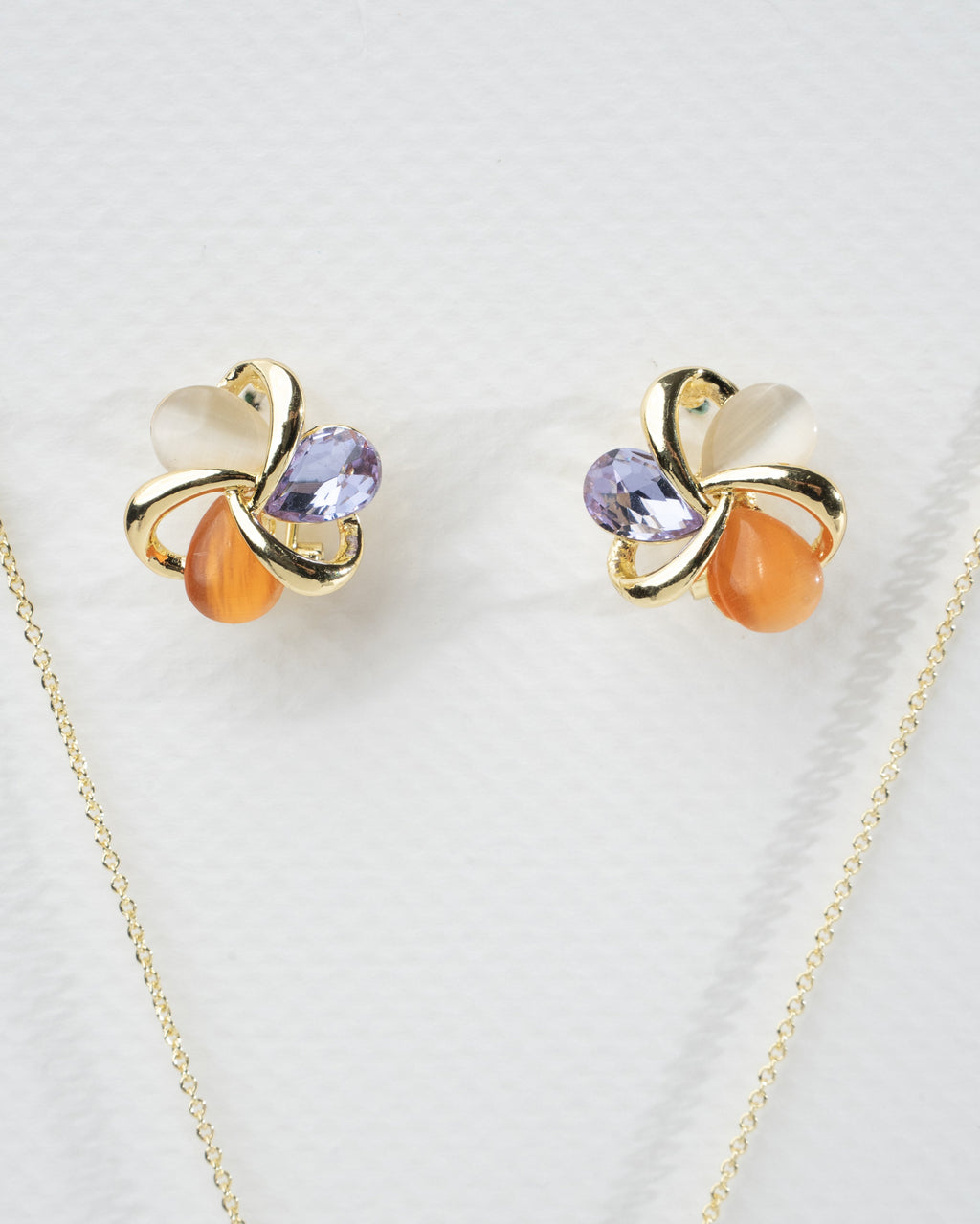 Elegant Multi-Stone Gold Twist Earrings