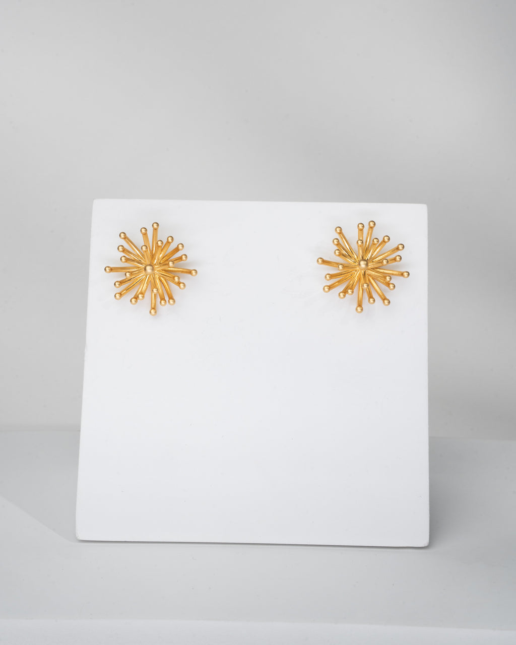 Radiant Sunburst Gold Tone Stud Earrings