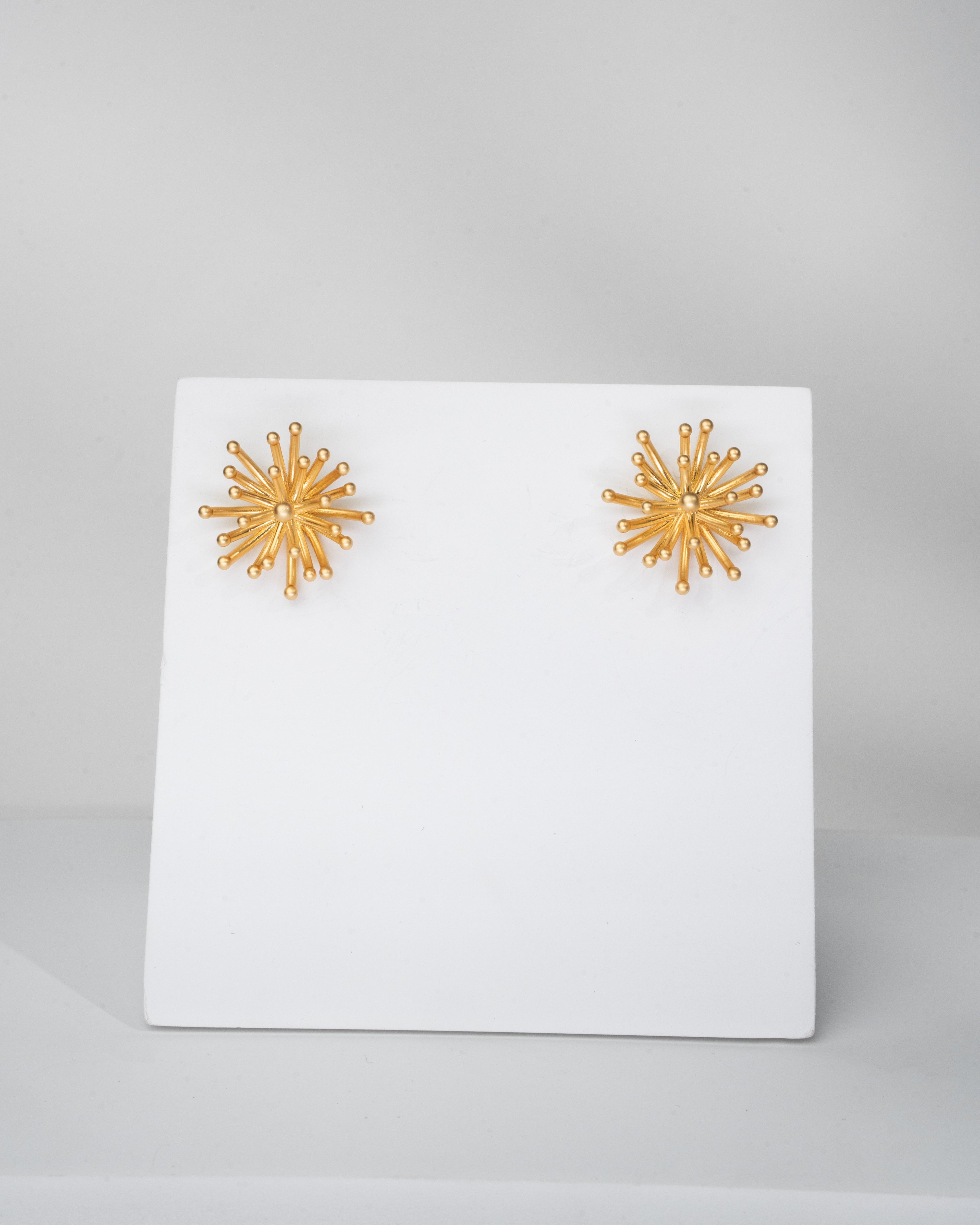 Radiant Sunburst Gold Tone Stud Earrings