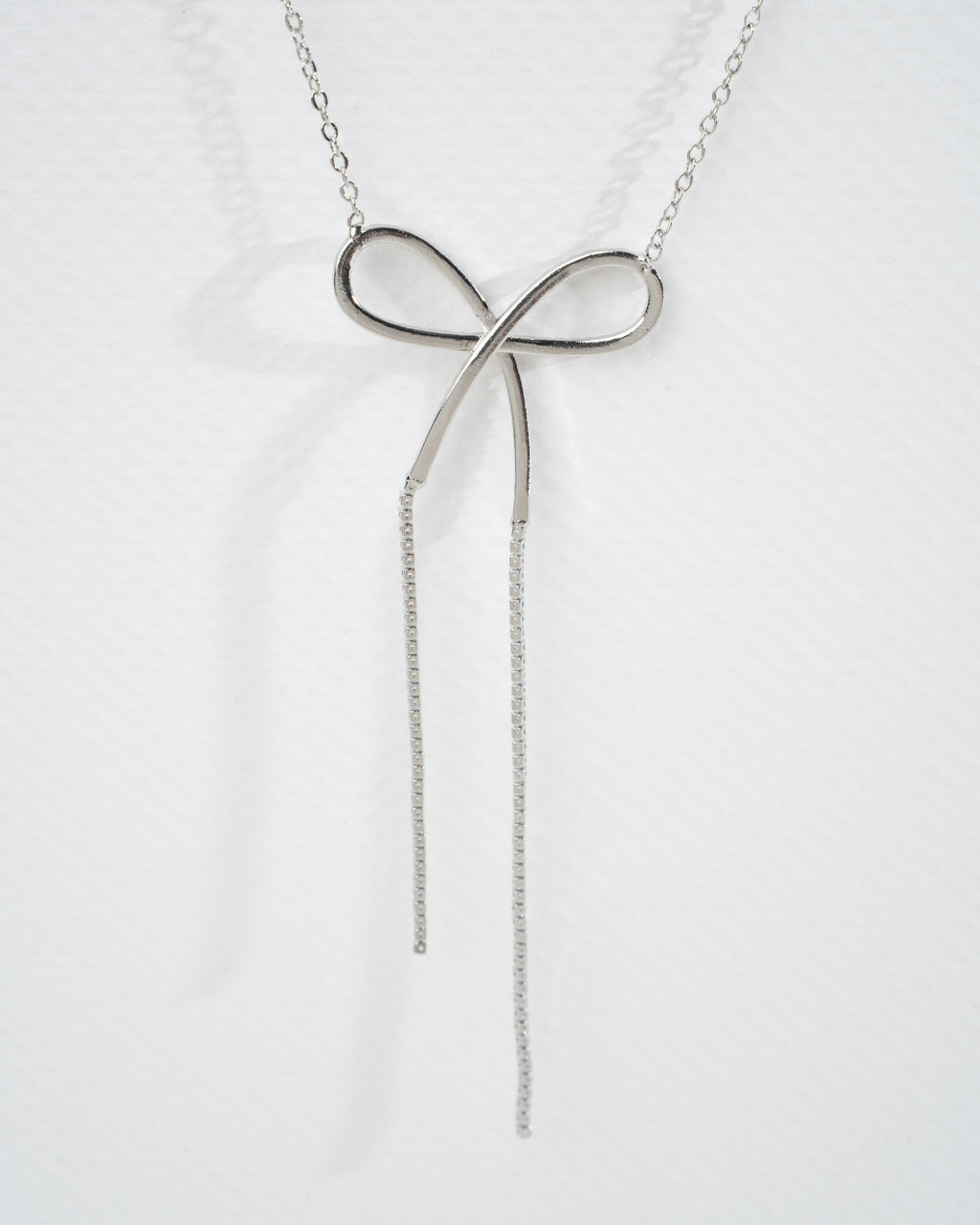 Elegant Silver Bow Necklace and Earring Set