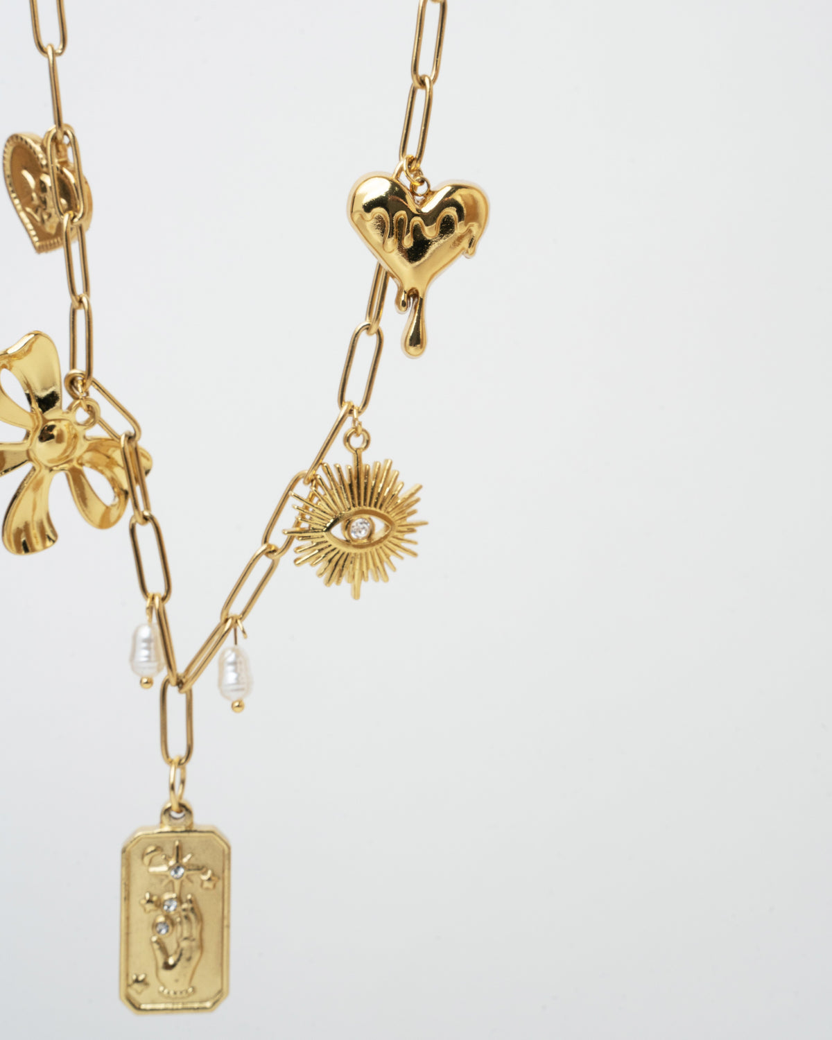 gold charm necklace featuring beautifully crafted pendants