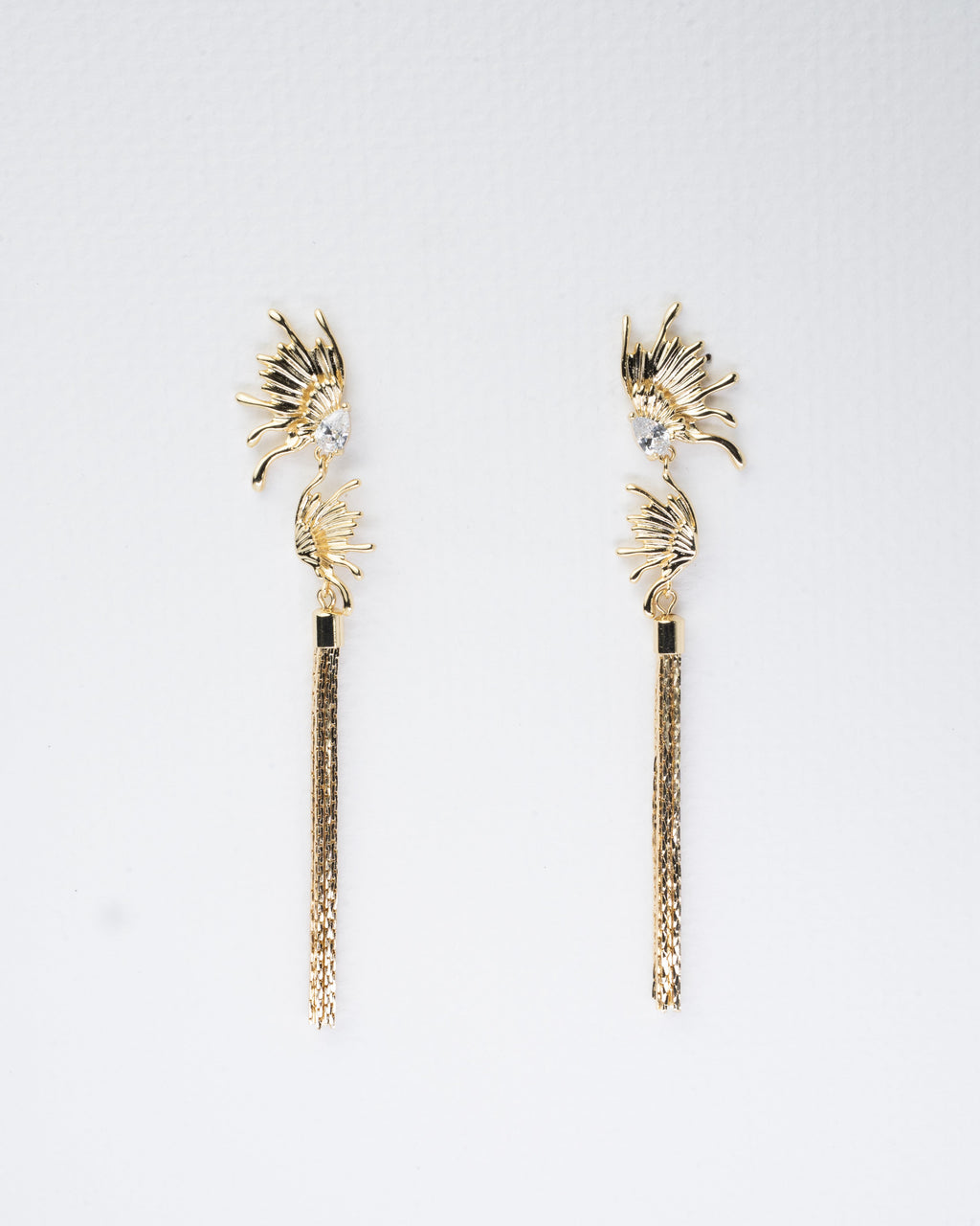 Elegant Sunburst Crystal and Gold Tassel Earrings