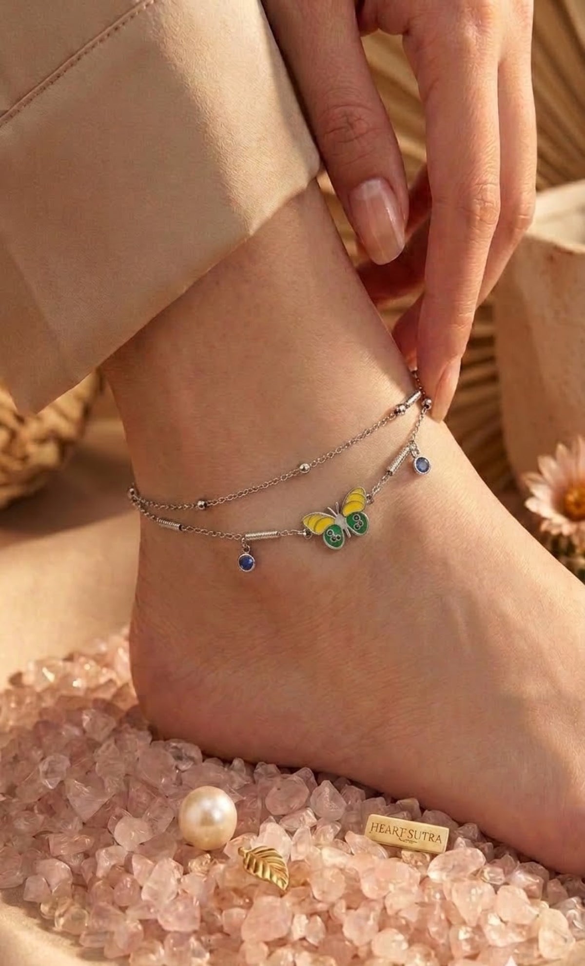 Silver-tone double-strand anklet with yellow-green enamel butterfly and blue crystal drops