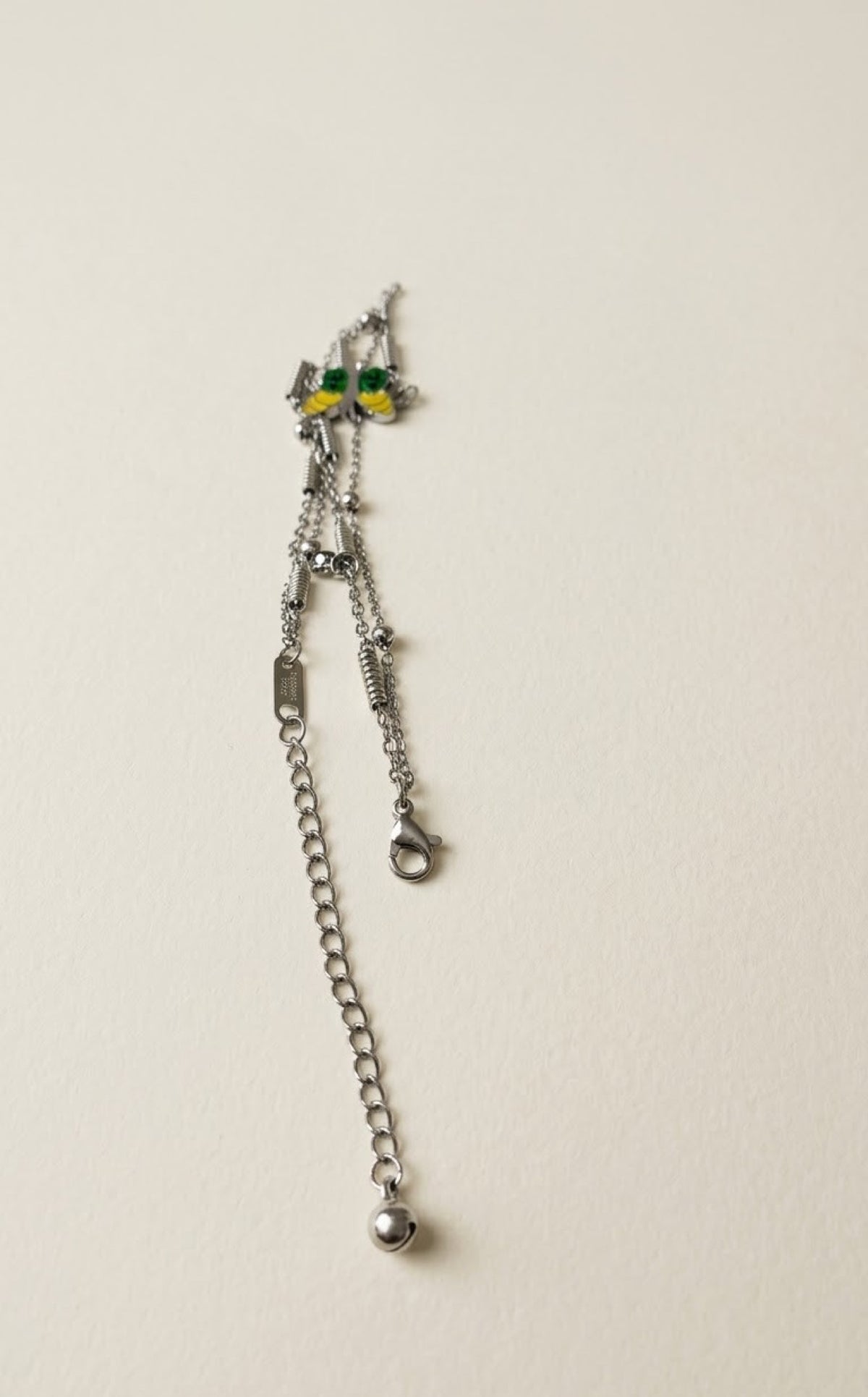 Silver-tone double-strand anklet with yellow-green enamel butterfly and blue crystal drops - view 3