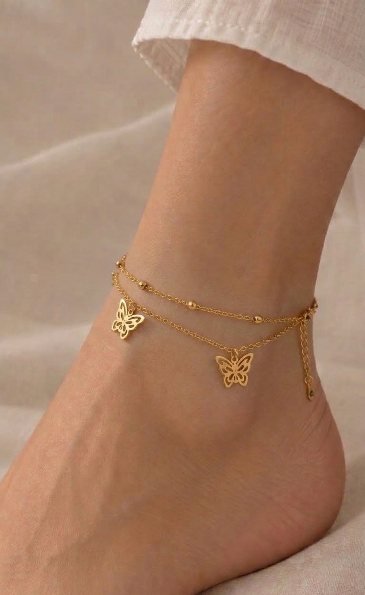 Gold-tone two-layer anklet with filigree butterfly charms