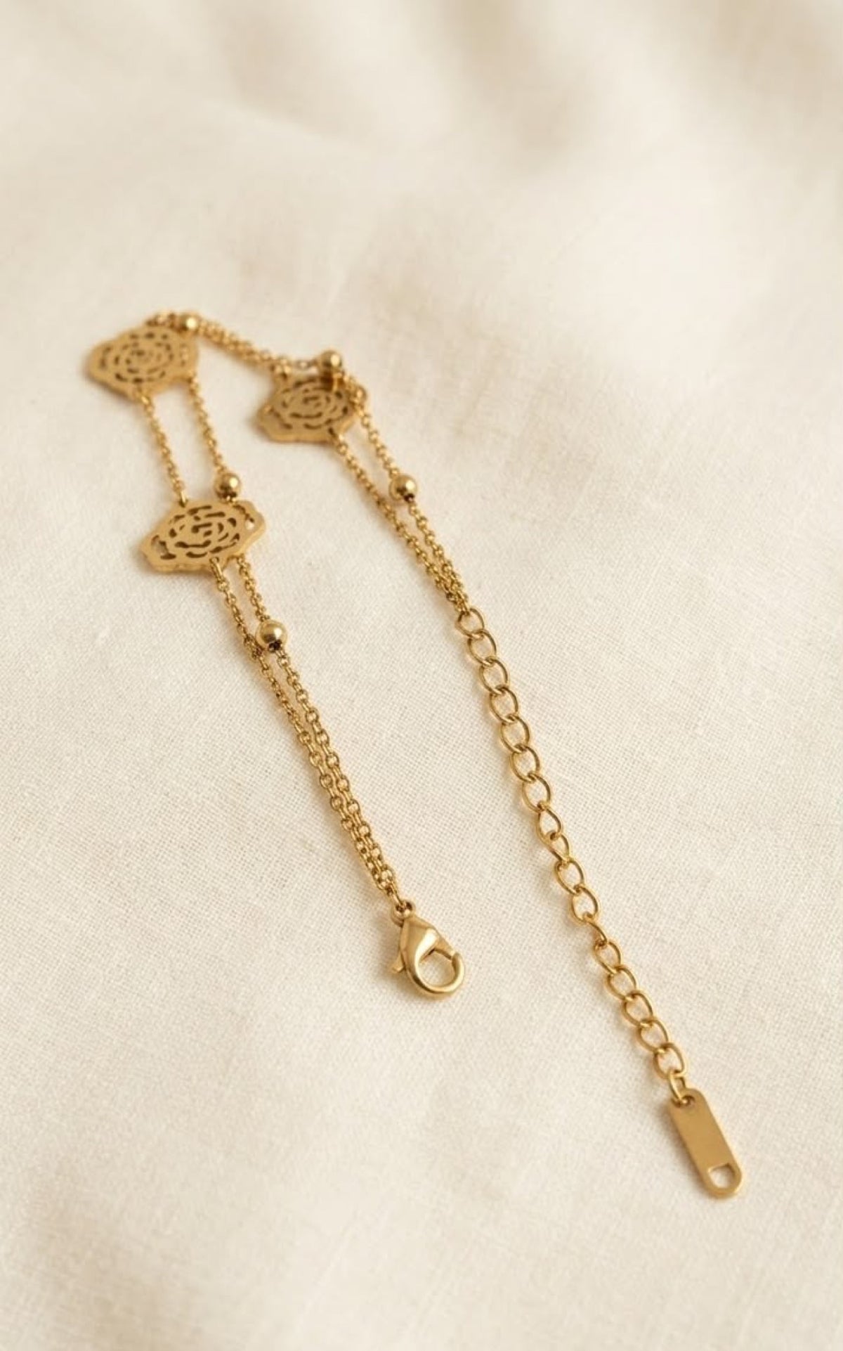 Double-strand gold-tone anklet with openwork rose medallions - view 3