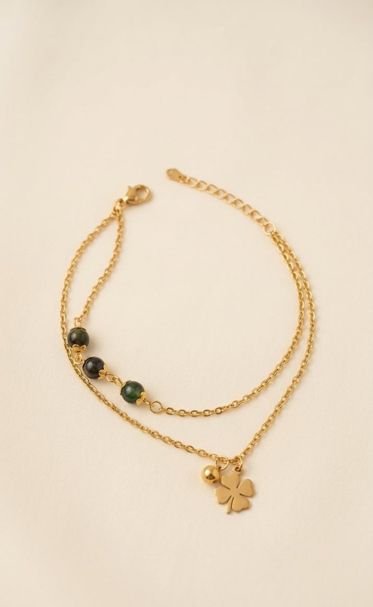 Gold-tone double-layer anklet with dark green beads and four-leaf clover charm - view 2