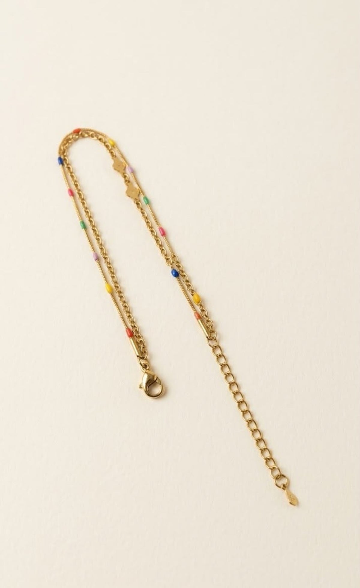 Pair of gold-tone layered anklets with rainbow enamel dots and swirl links - view 3
