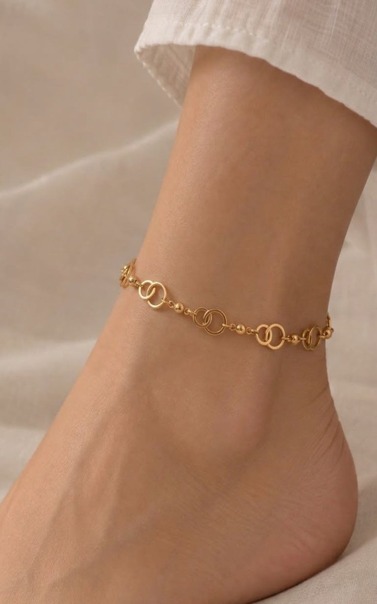Gold-tone anklet with interlocking ring links and beads