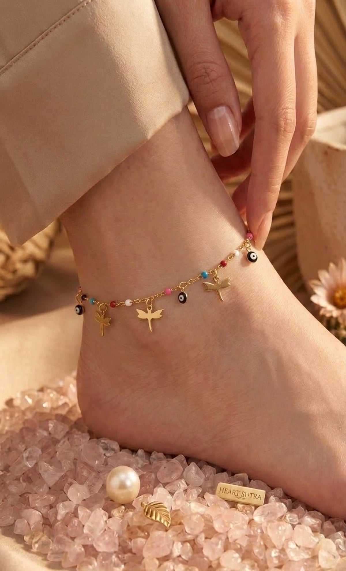 Gold-tone anklet with dragonfly charms, evil eyes and multicolour enamel beads