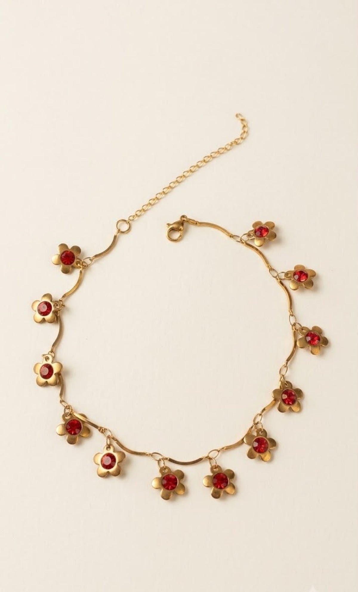 Gold-tone scalloped anklet with flower charms and red crystals - view 2