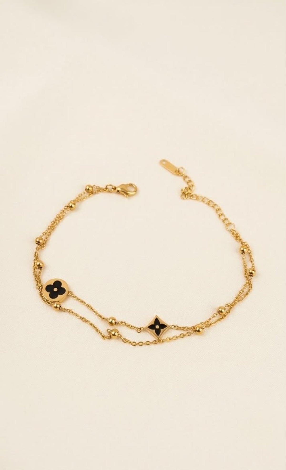 Double-strand gold-tone anklet with black enamel clover and star charms - view 2