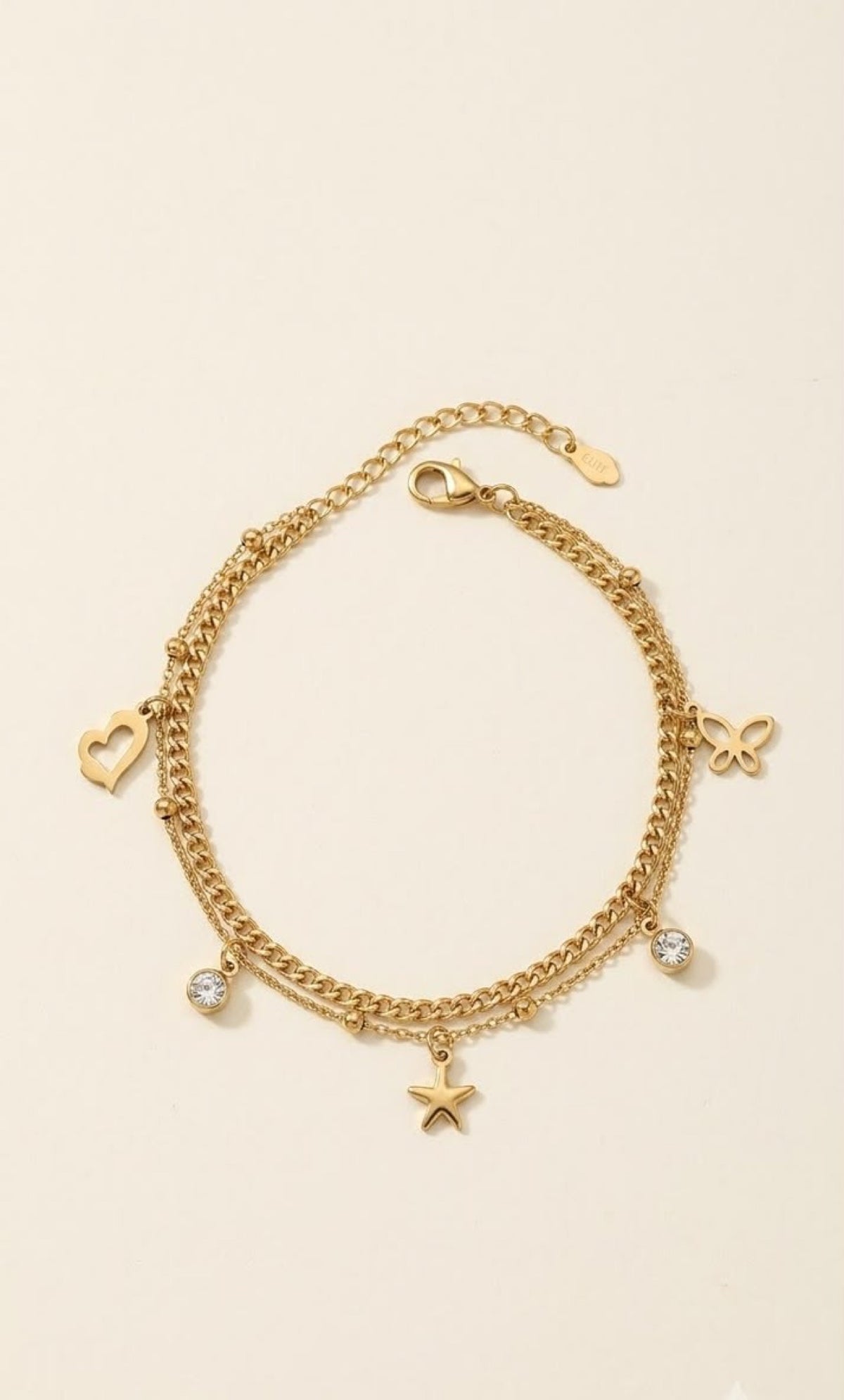 Gold-tone layered anklet with heart, star, butterfly and crystal charms - view 2