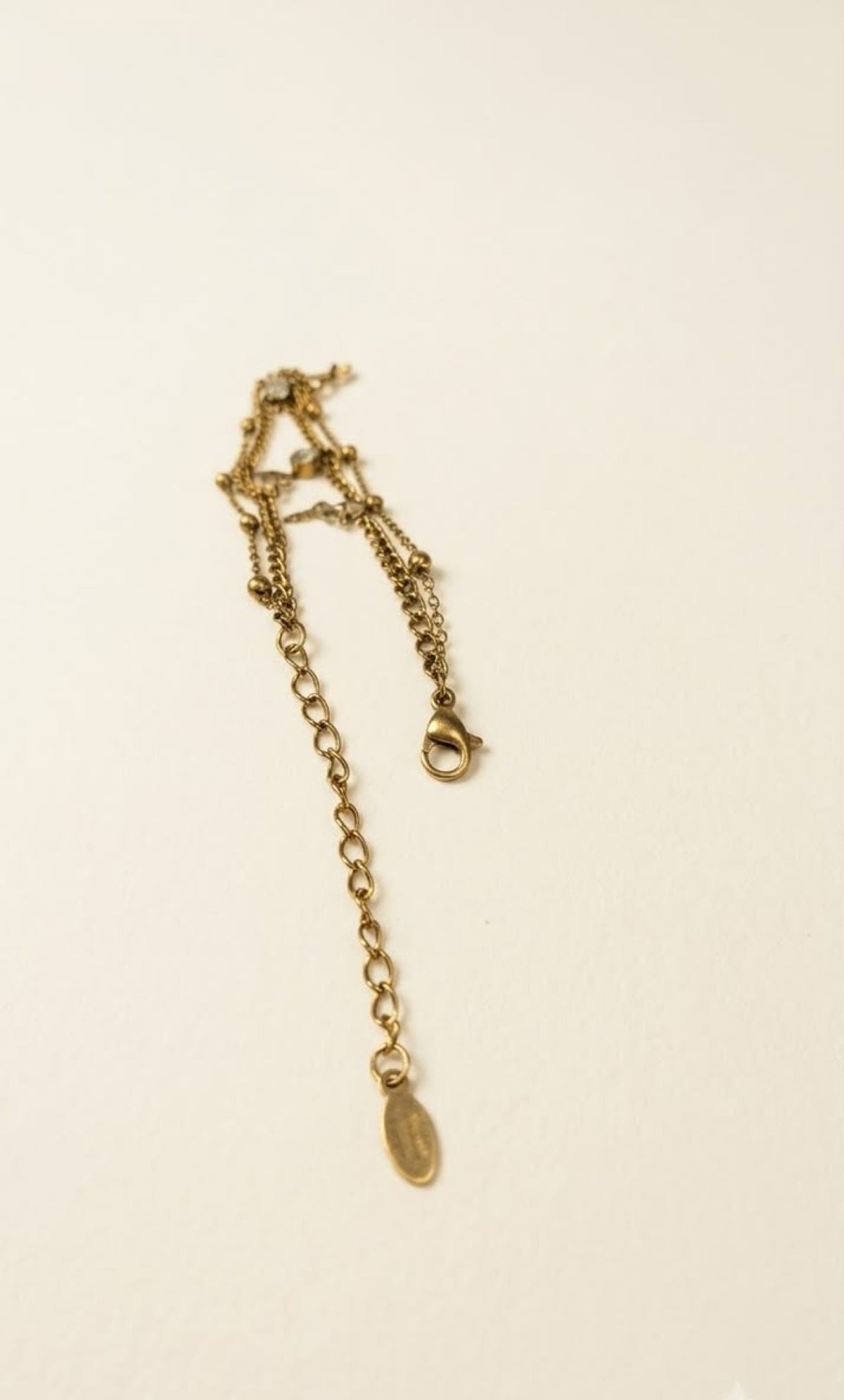 Gold-tone layered anklet with heart, star, butterfly and crystal charms - view 3