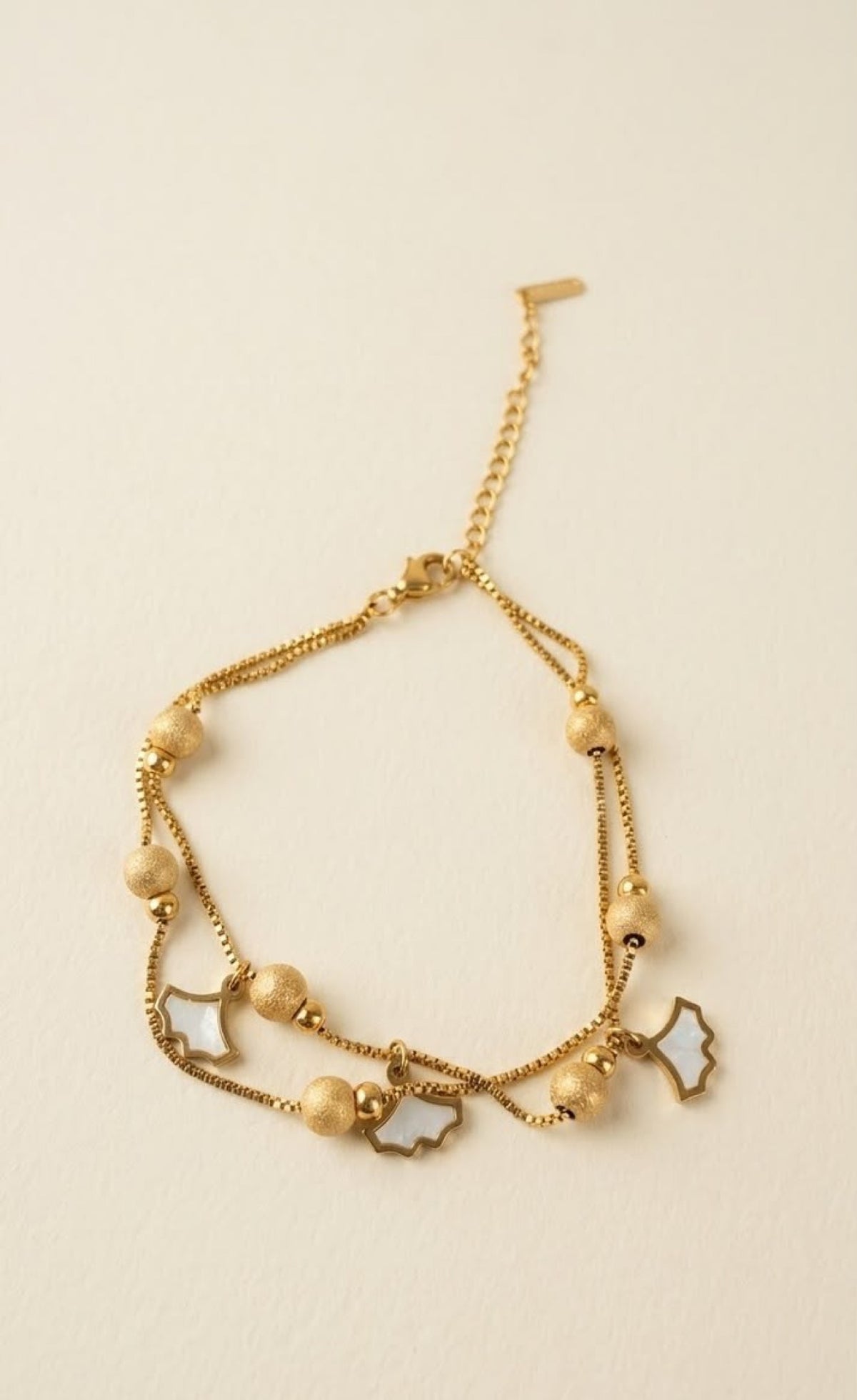 Double box-chain gold-tone anklet with frosted beads and white ginkgo leaf charms - view 2