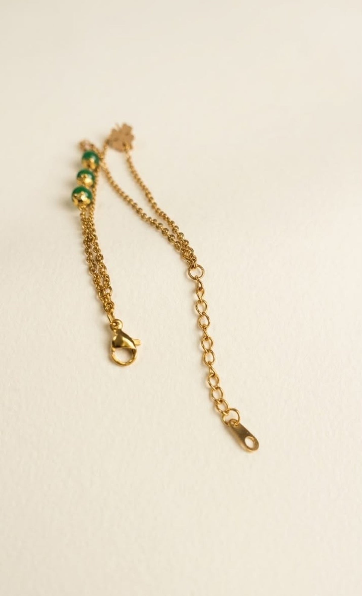 Gold-tone two-strand anklet with jade-green beads and four-leaf clover - view 2