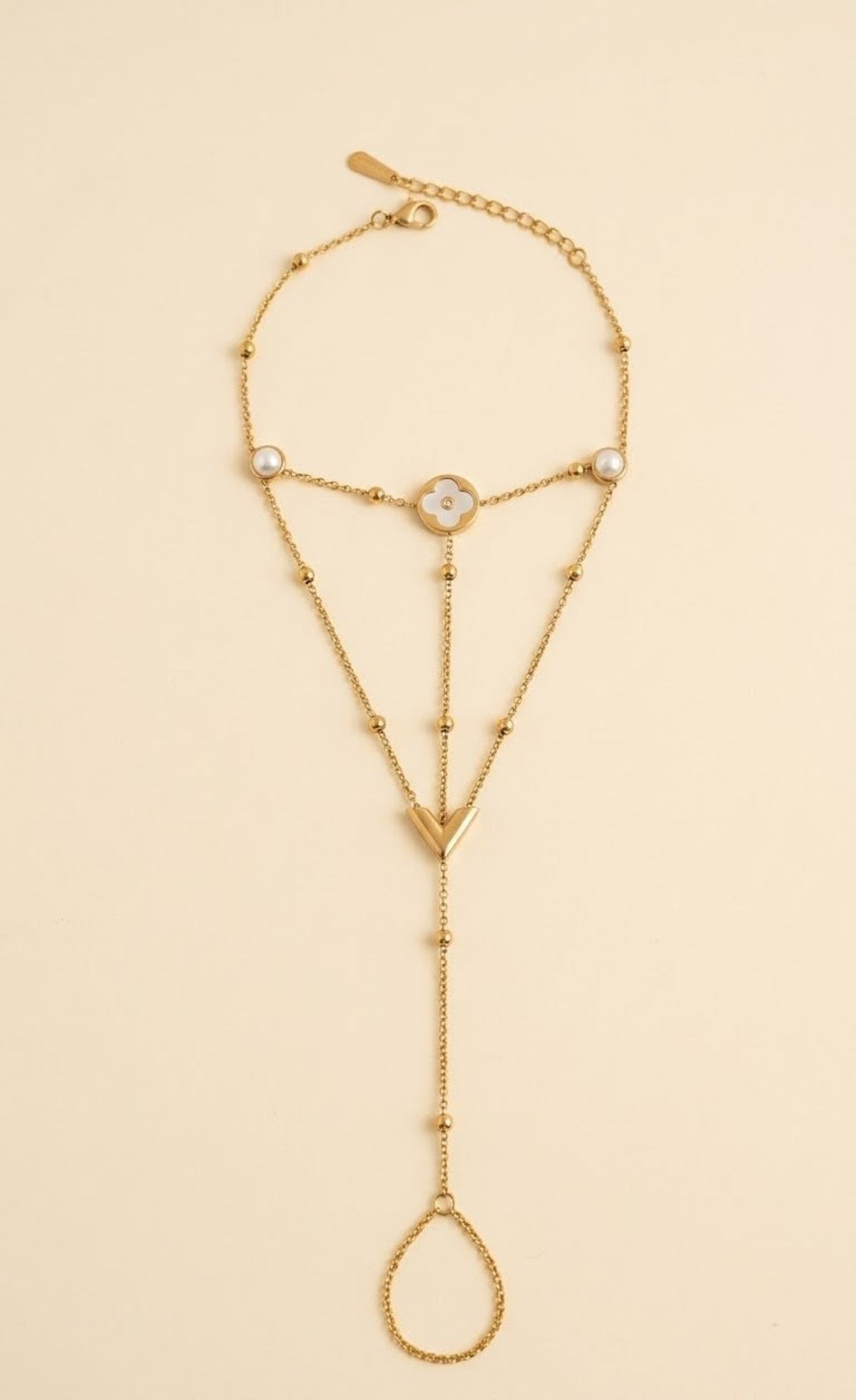 Pair of gold-tone barefoot anklets with white clover medallion, faux pearls and toe loop - view 2
