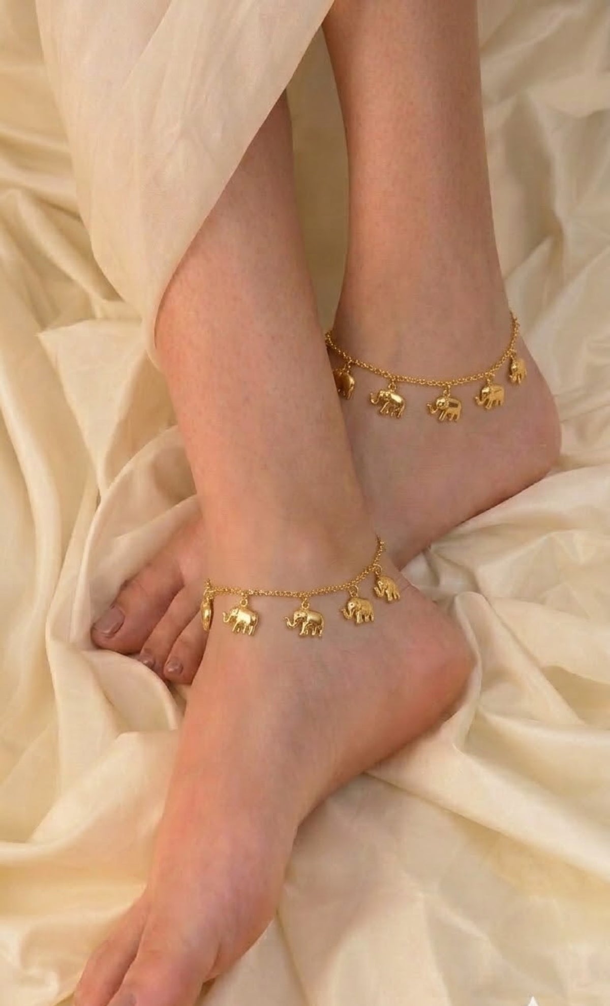 Pair of gold-tone anklets with dangling elephant charms