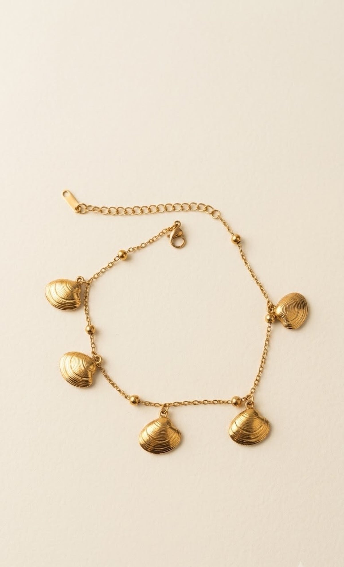 Pair of gold-tone anklets with ridged clamshell charms - view 2