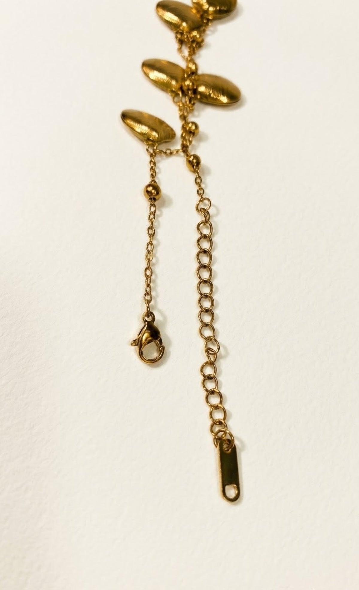 Pair of gold-tone anklets with ridged clamshell charms - view 3