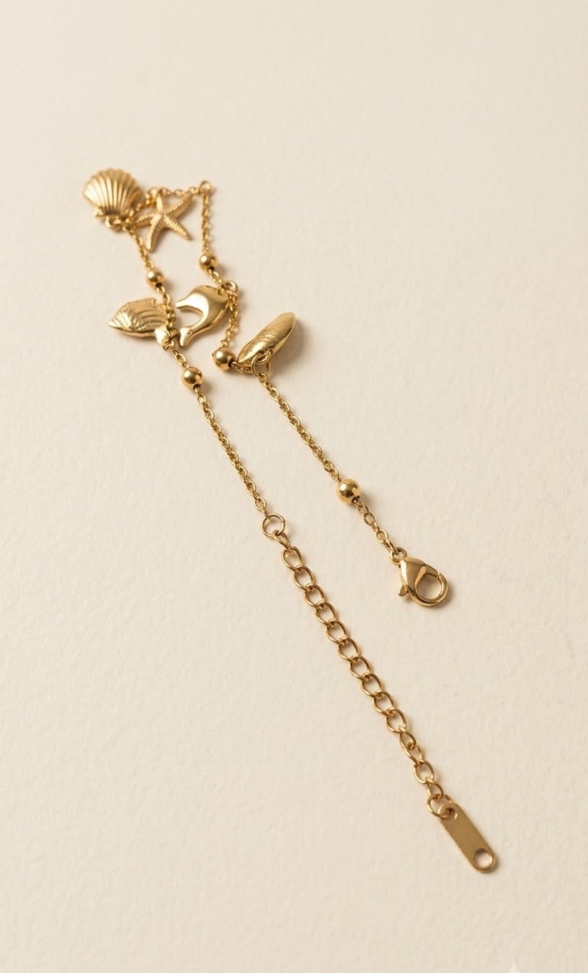 Gold-tone anklet with seashell, starfish and dolphin charms - view 3