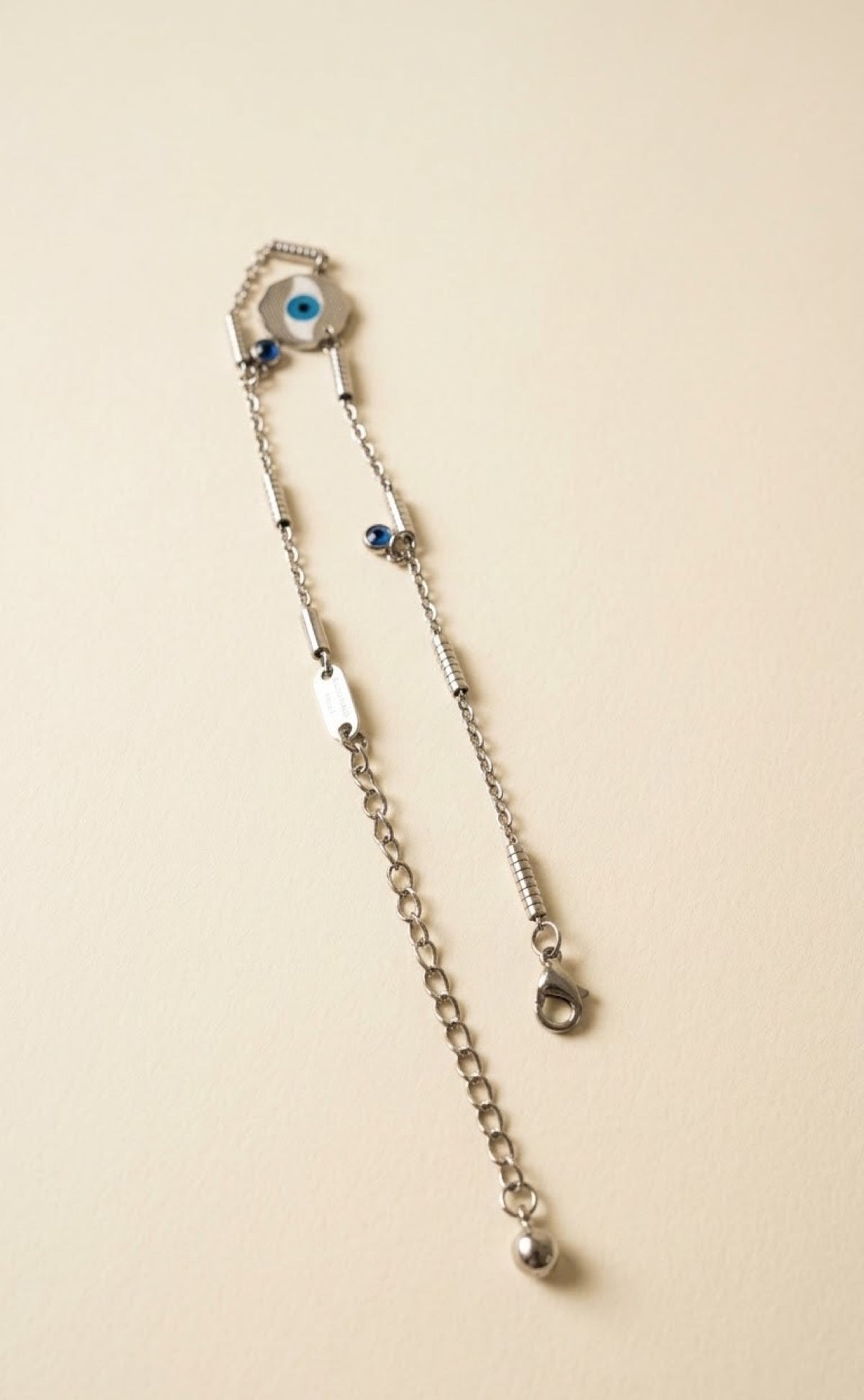 Pair of silver-tone anklets with blue evil eye disc and blue stone drops - view 3