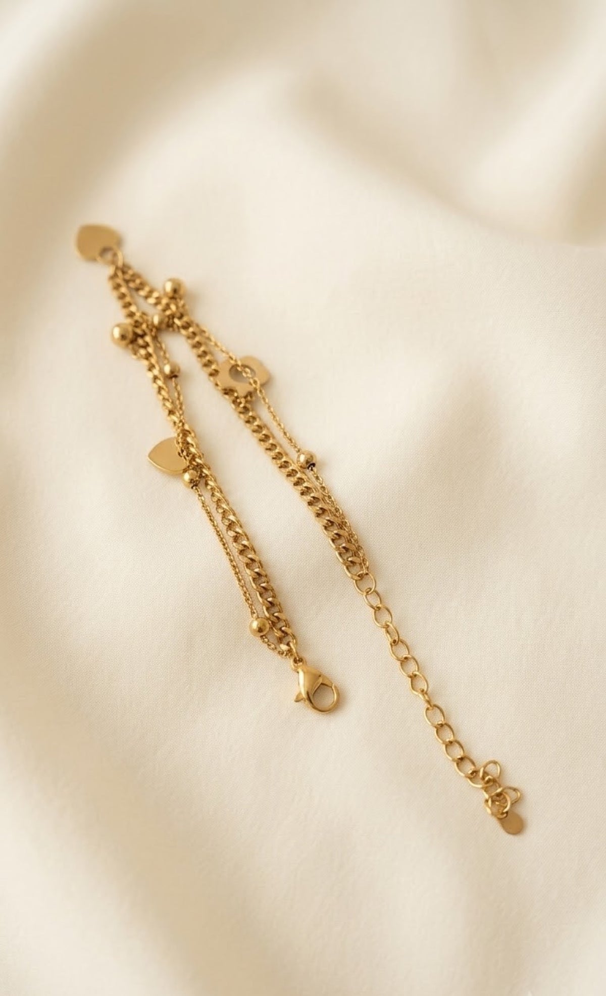 Pair of layered gold-tone anklets with heart, flower and peace charms - view 3