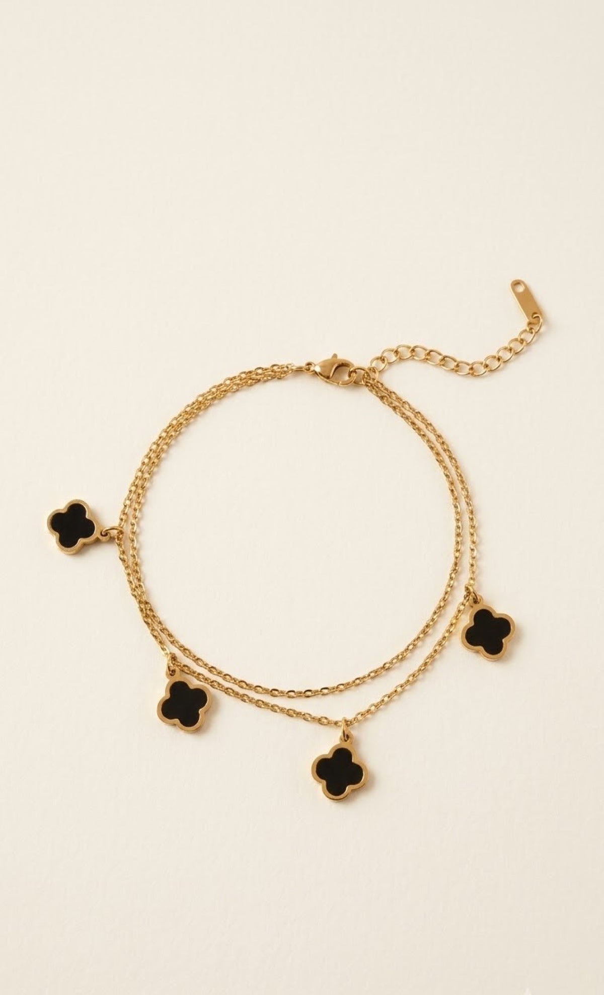 Gold-tone double-chain anklet with black four-leaf clover charms - view 2
