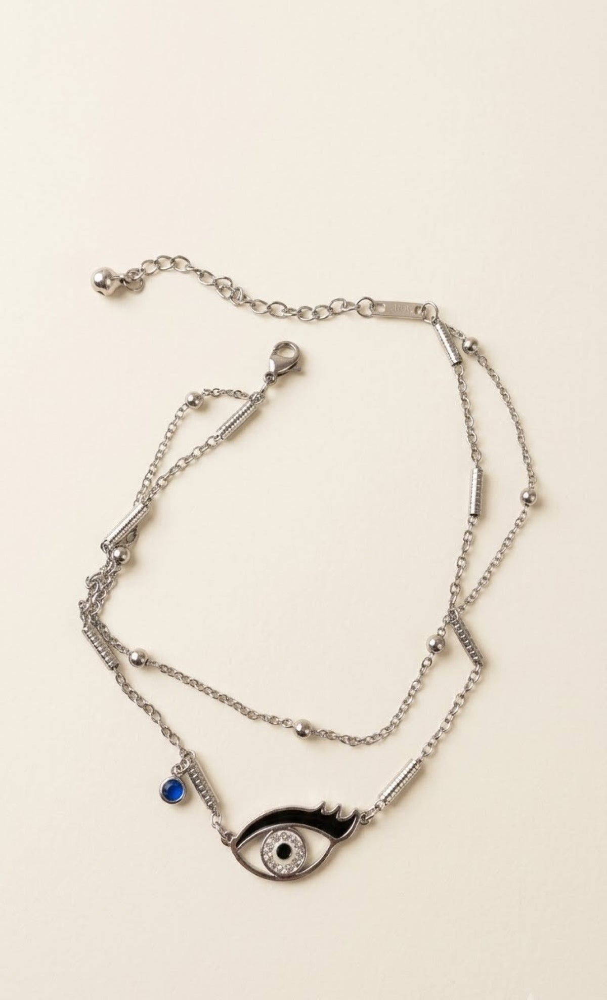 Silver-tone layered anklet with black enamel crystal eye charm and blue stone - view 2